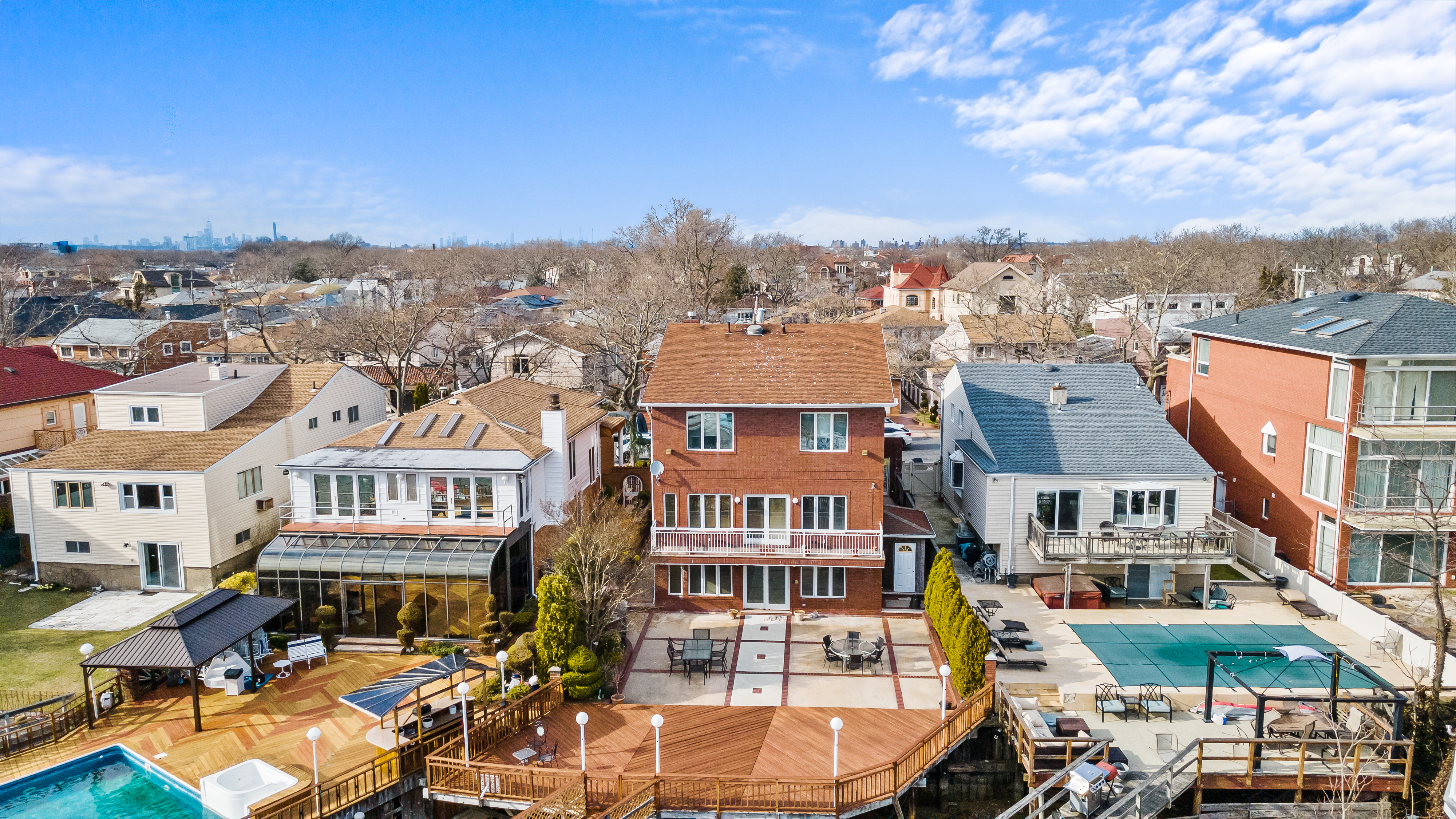 303 Whitman Drive Brooklyn, NY 11234 - Photo 35 of 37 an aerial view of a residential apartment building with parking space and city view