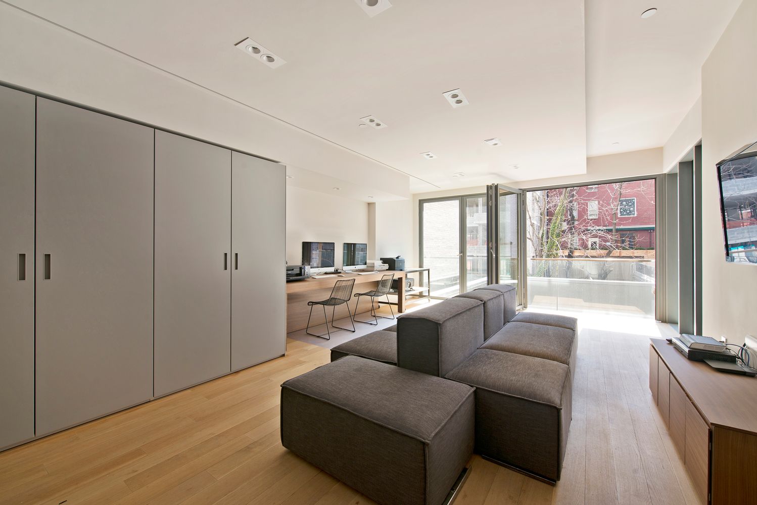 123 3rd Avenue, Unit 5D Manhattan, NY 10003 - Photo 9 of 12 a living room with furniture and a large window