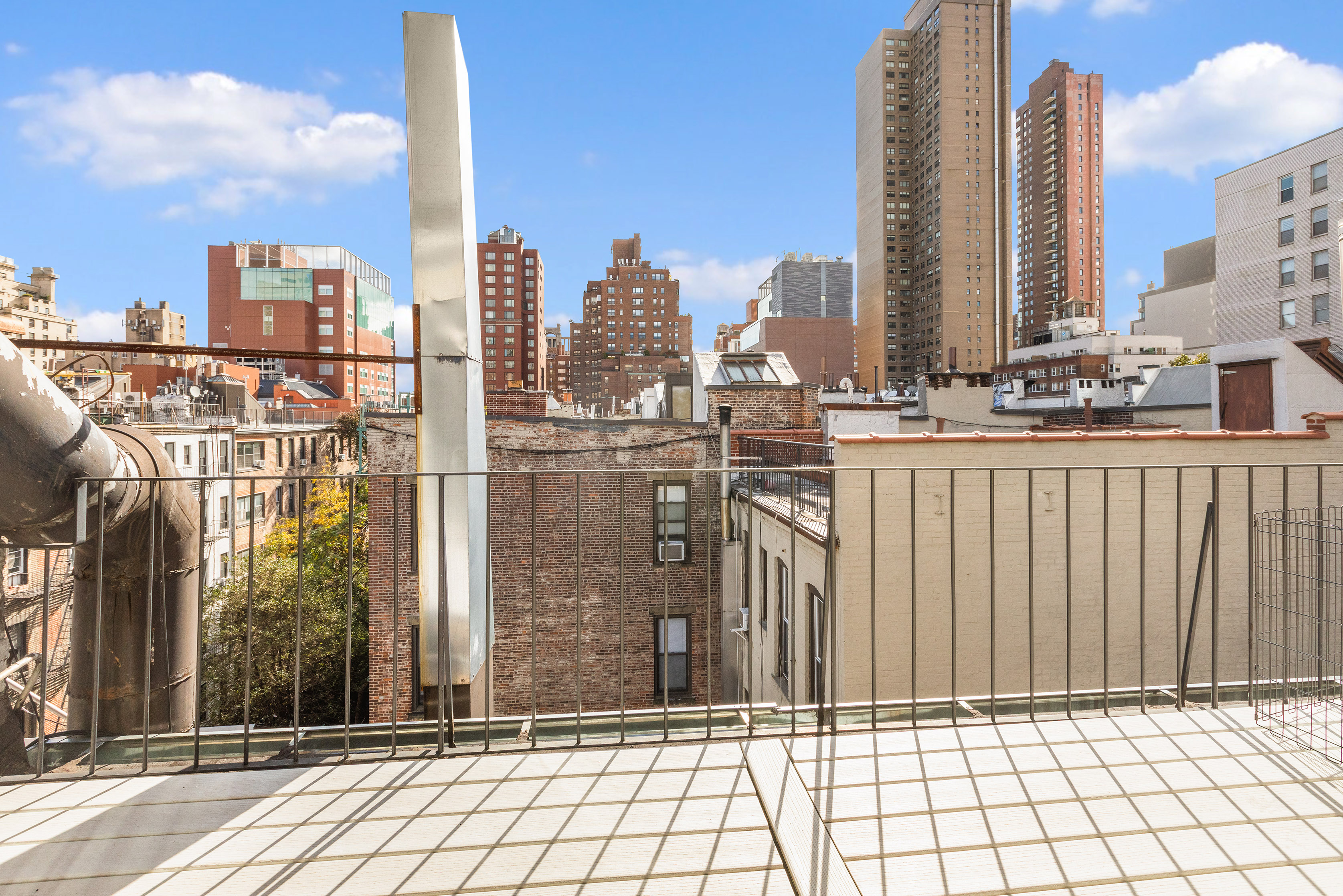 1582 York Avenue, Unit 5B Manhattan, NY 10028 - Photo 4 of 14 a view of a city with tall buildings