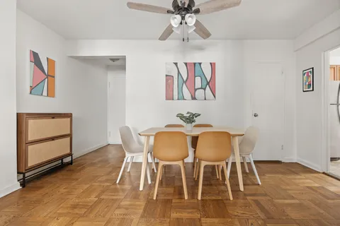 a view of a room with furniture and wooden floor