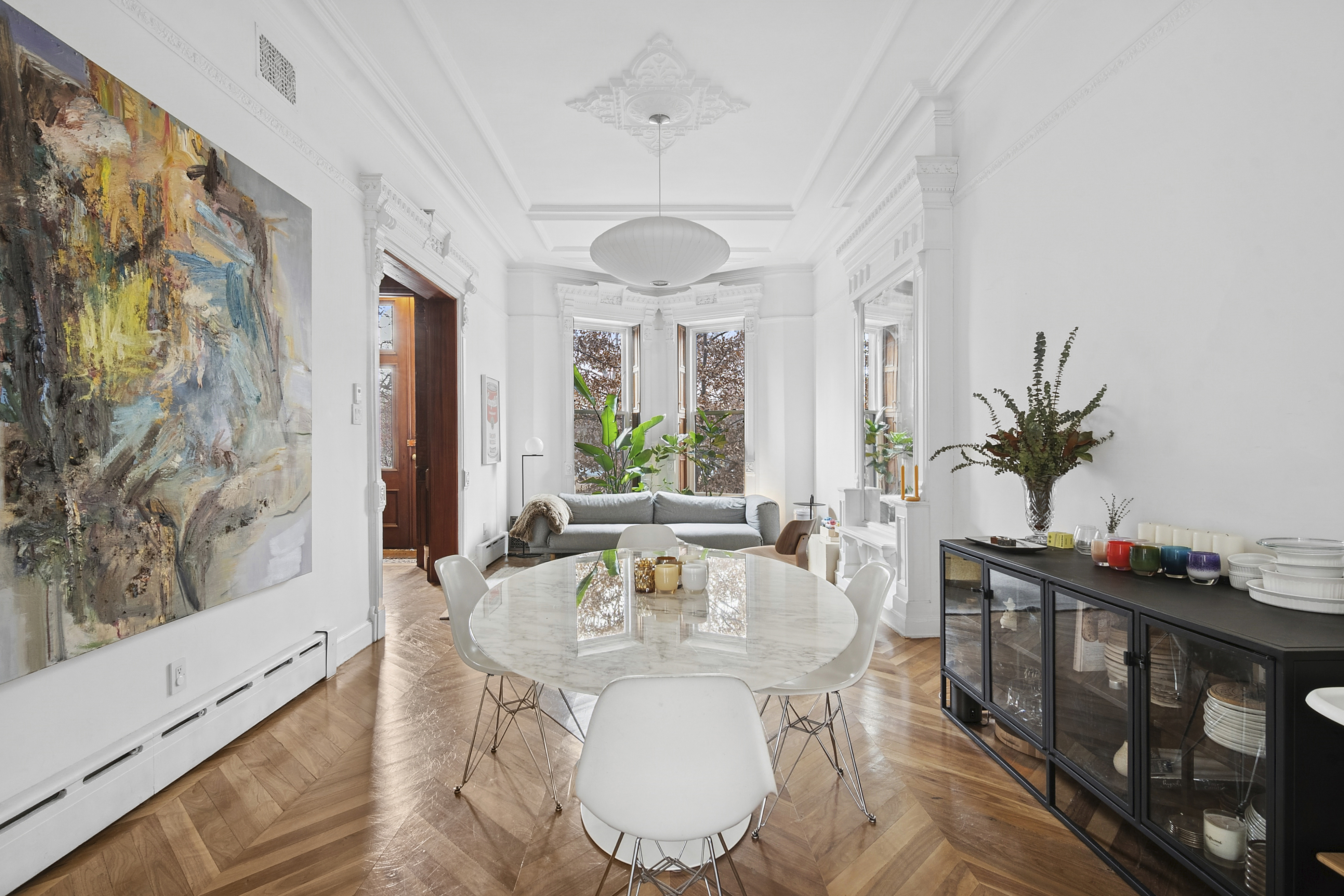 a view of a dining room with furniture window and wooden floor