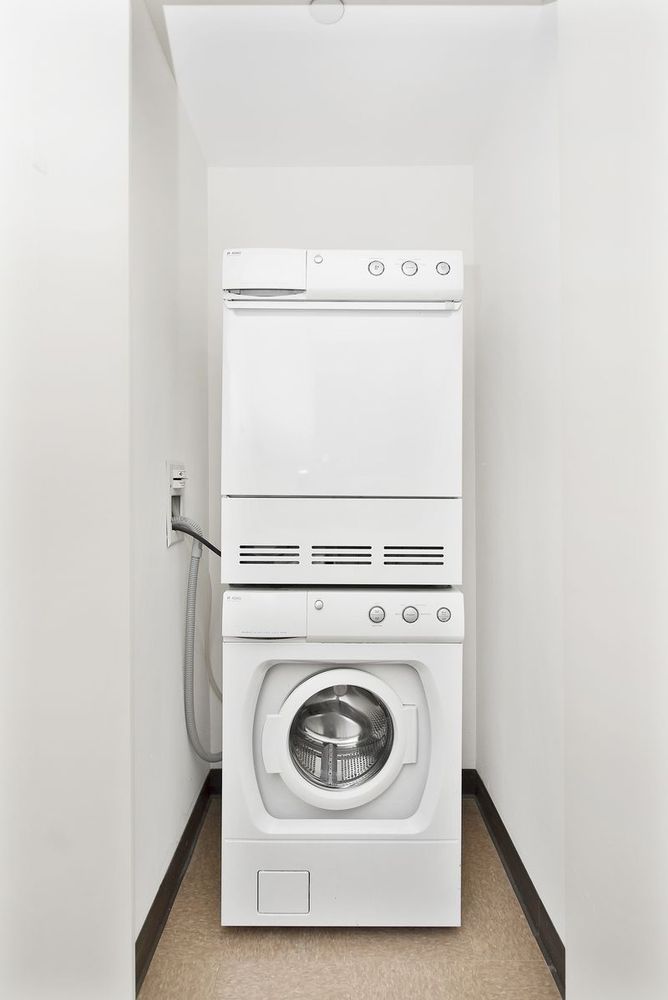 225 East 34th Street, Unit PHD Manhattan, NY 10016 - Photo 5 of 12 a utility room with dryer and washer