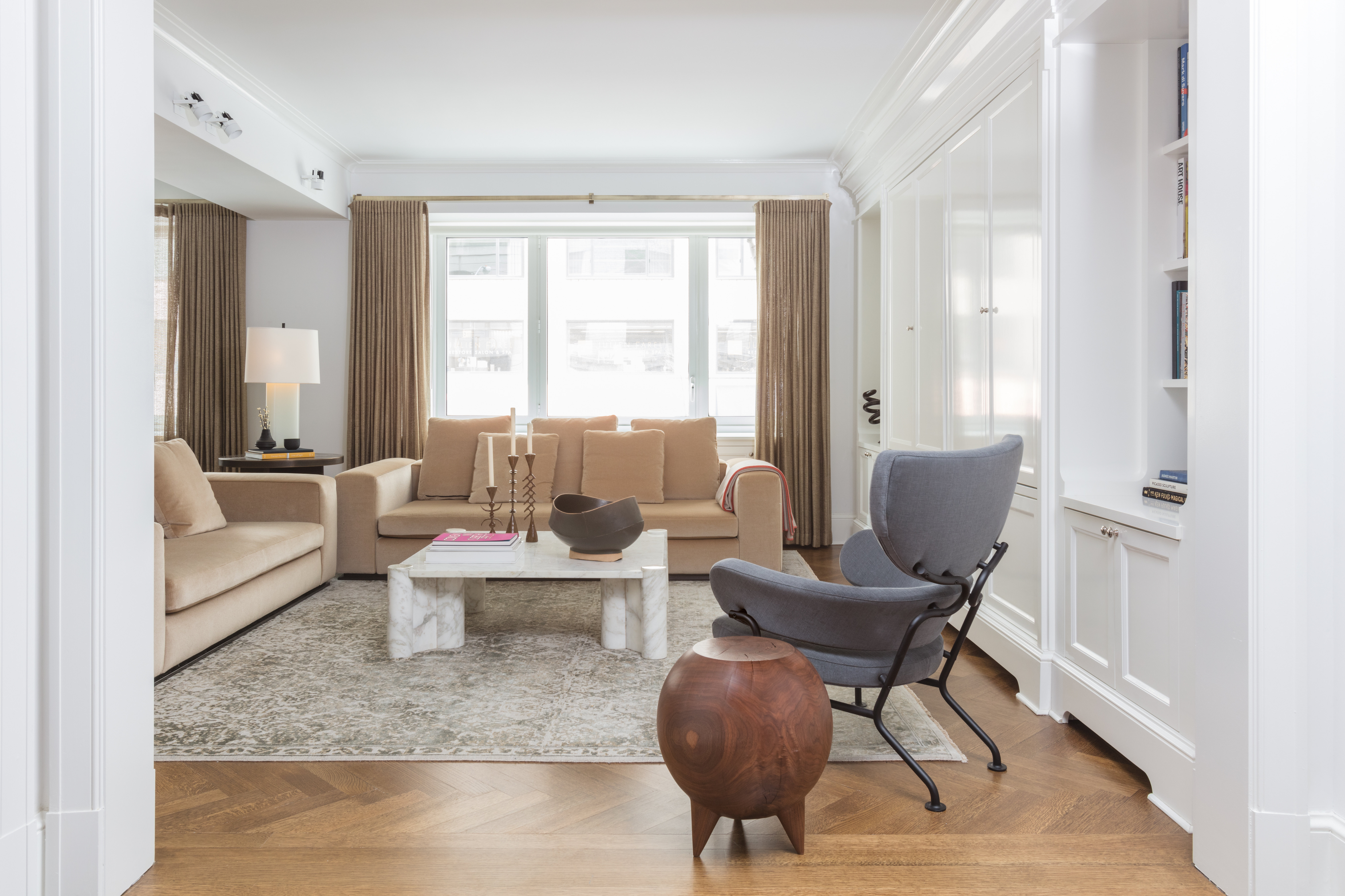 530 Park Avenue, Unit 2F Manhattan, NY 10065 - Photo 2 of 19 a living room with furniture and a large window
