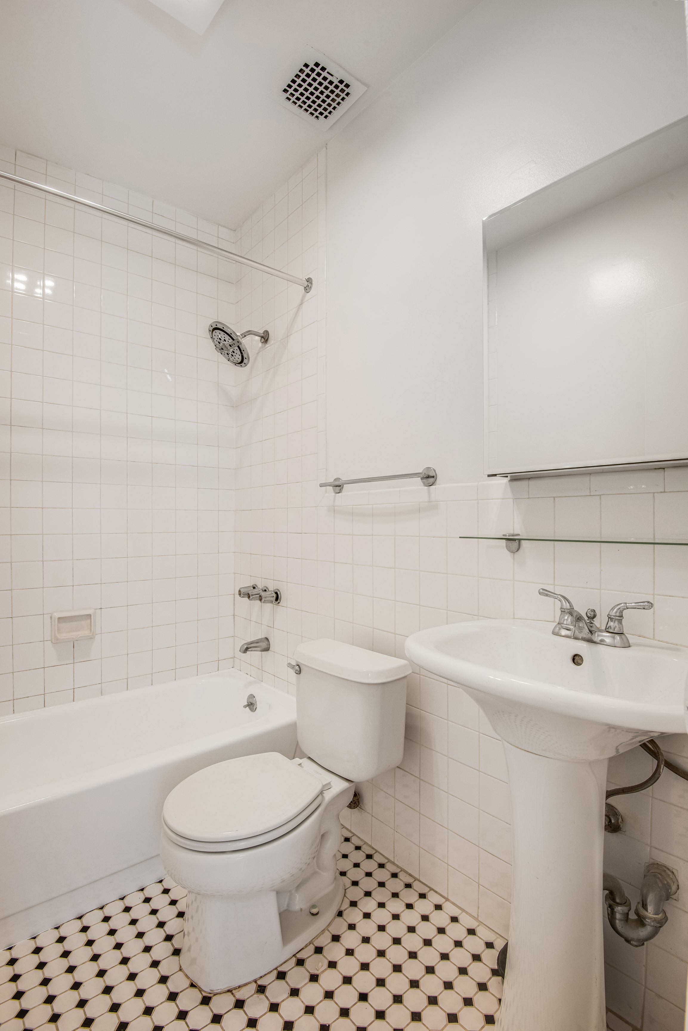 182 East 2nd Street, Unit 1E Manhattan, NY 10009 - Photo 10 of 14 a bathroom with a sink toilet and shower