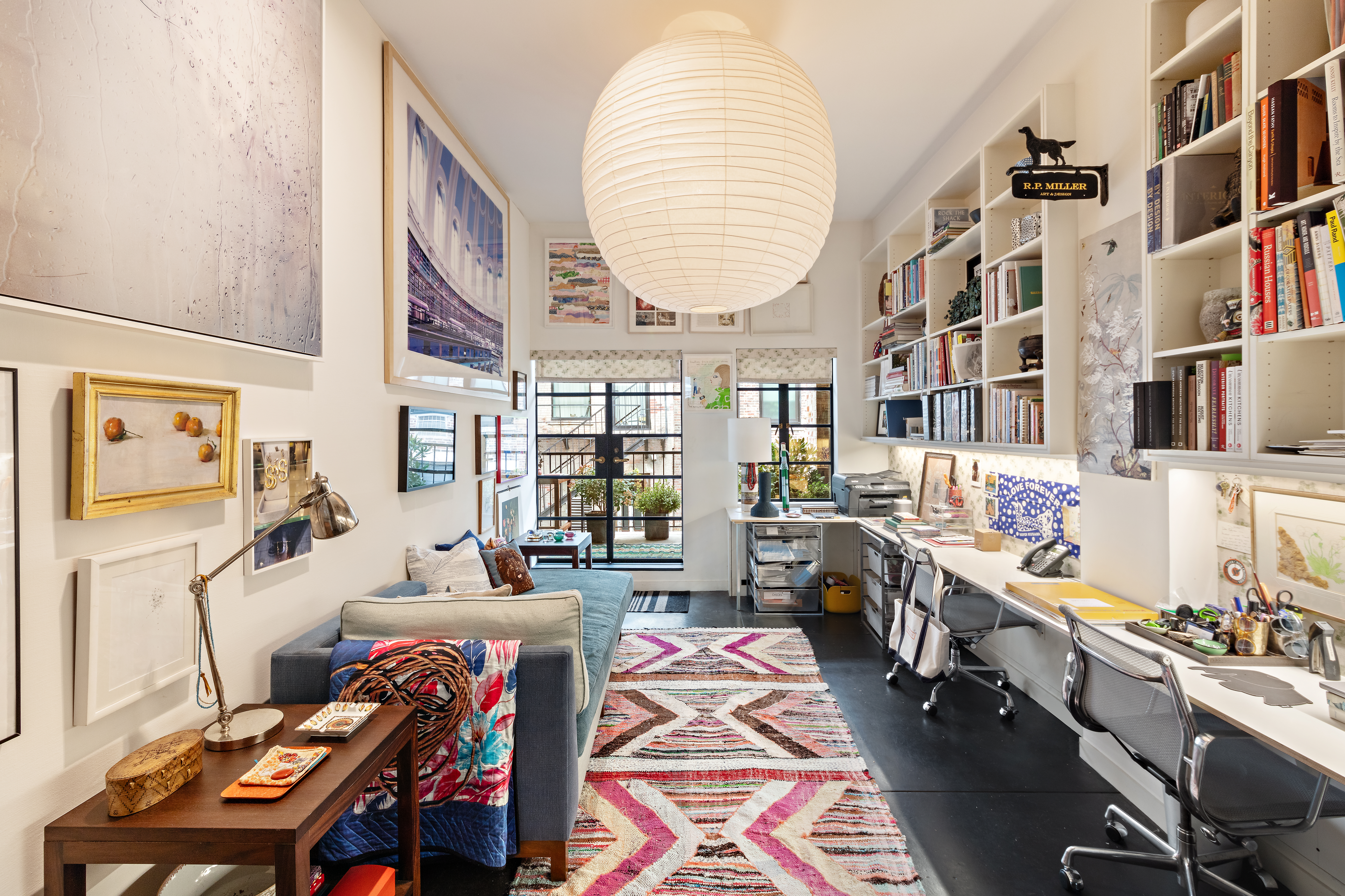 35 East 10th Street, Unit 8BC Manhattan, NY 10003 - Photo 9 of 11 a bedroom with furniture and a book shelf