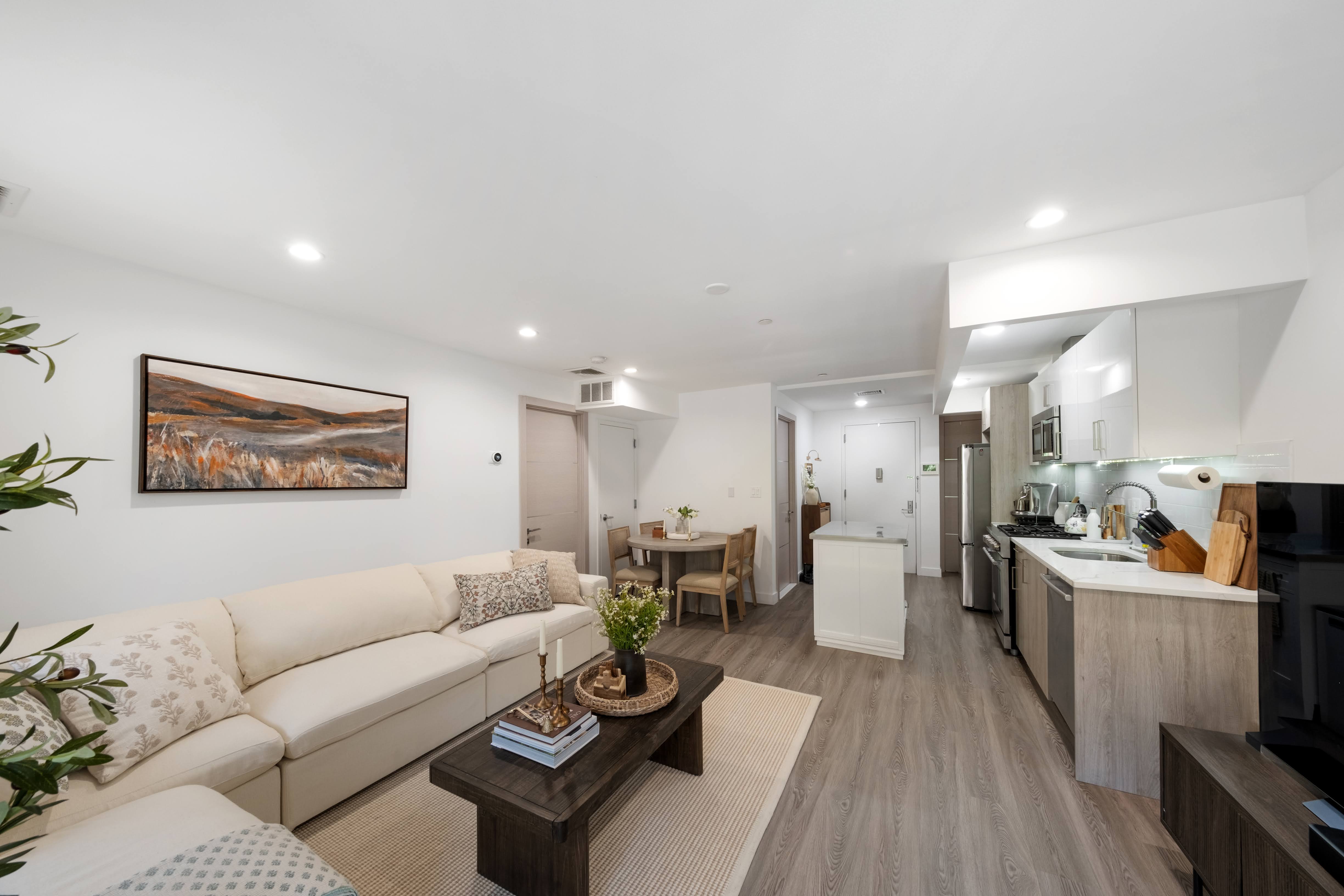 2025 Ocean Avenue, Unit 1B Brooklyn, NY 11230 - Photo 2 of 10 a living room with furniture and kitchen view