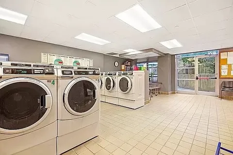 a view of a chair and tables in the backyard of the house