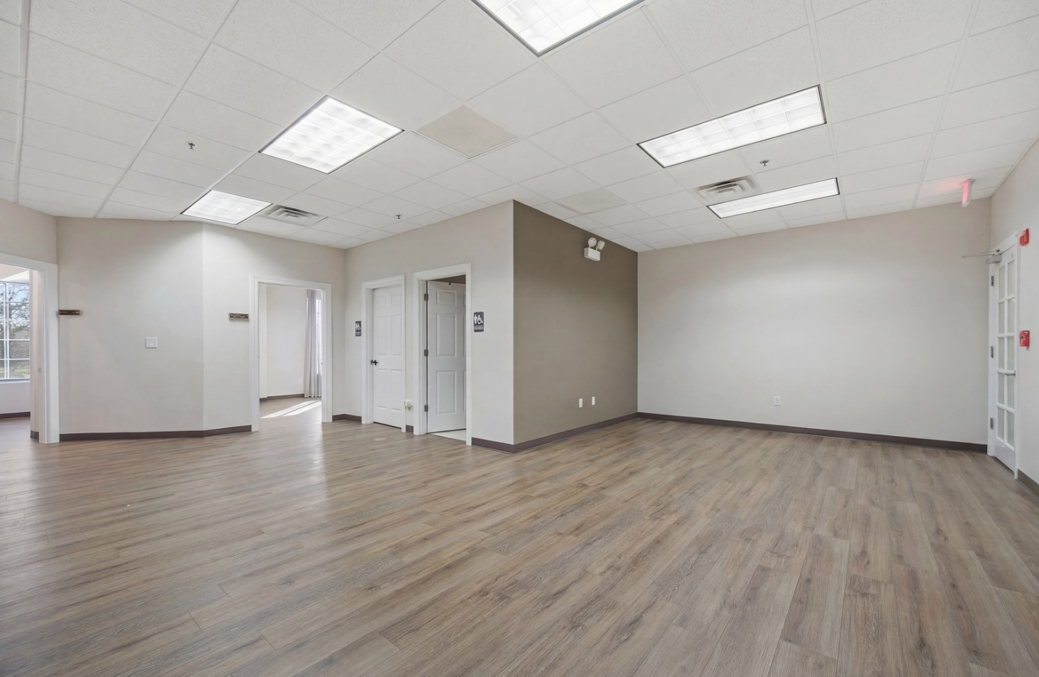 6475 Washington Street Gurnee, IL 60031 - Photo 32 of 45 an empty room with wooden floor and windows