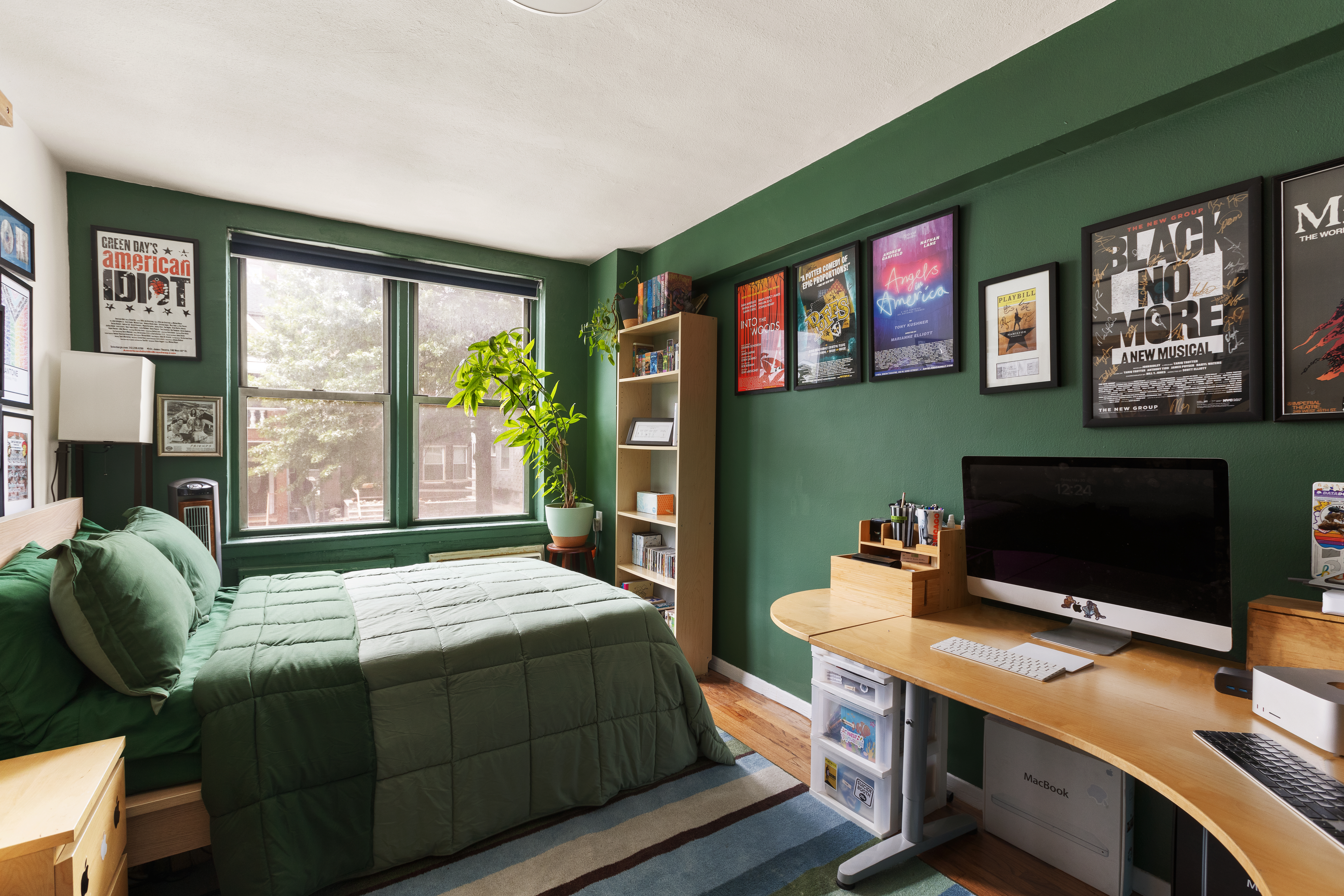 495 East 7th Street, Unit 2F Brooklyn, NY 11218 - Photo 4 of 10 a bedroom with a bed bookshelf and a flat screen tv
