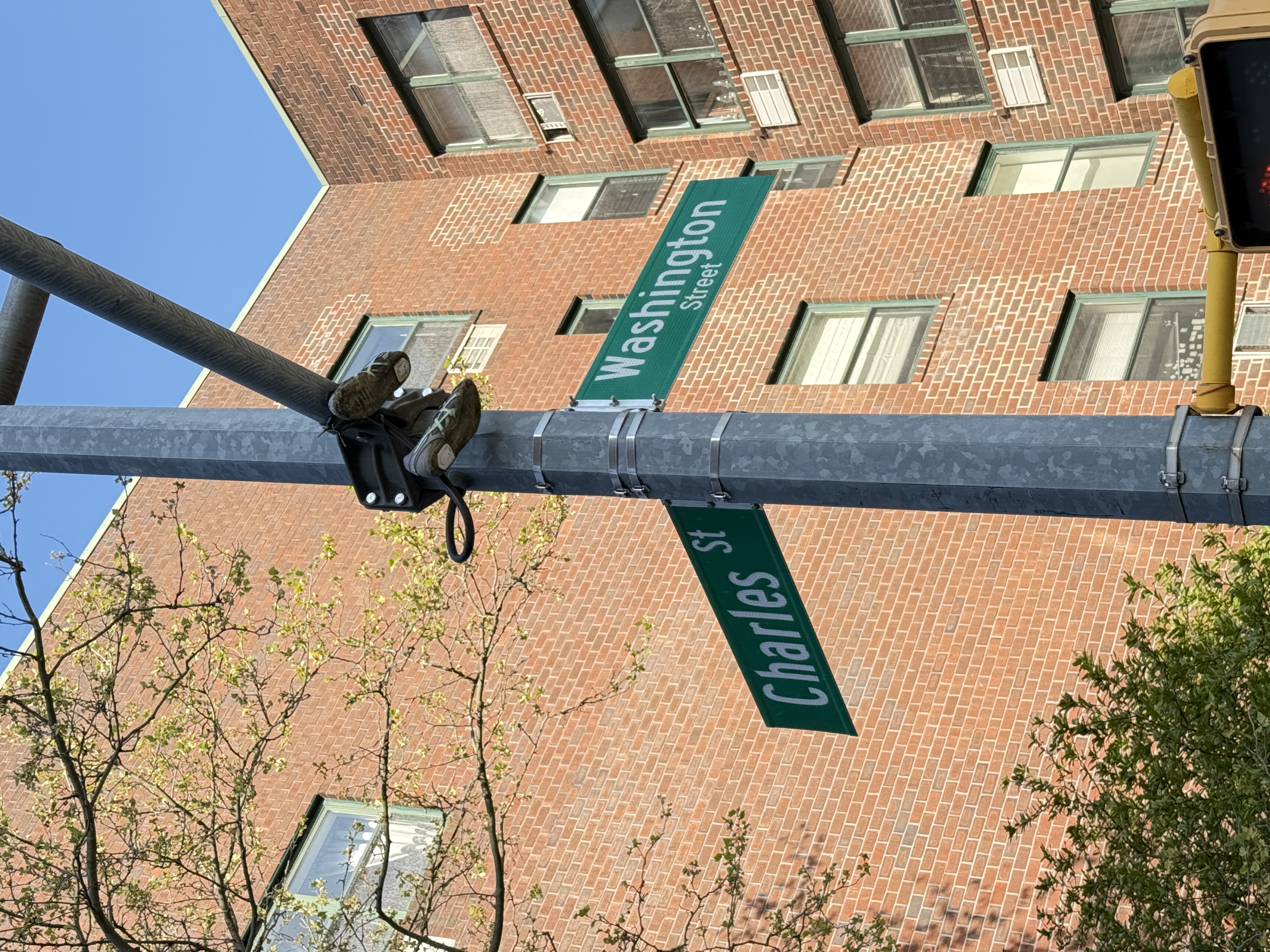 680 Washington Street, Unit 1B Manhattan, NY 10014 - Photo 11 of 13 a street sign on a wall next to a building