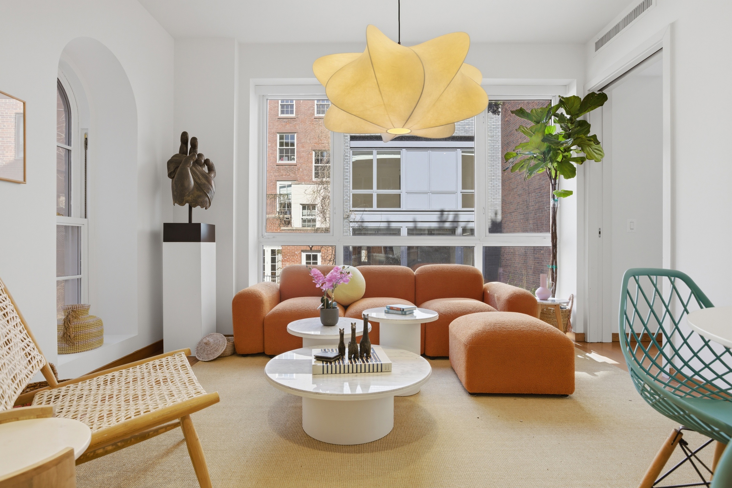 135 West 4th Street, Unit 2W Manhattan, NY 10012 - Photo 1 of 20 a living room with furniture and a potted plant