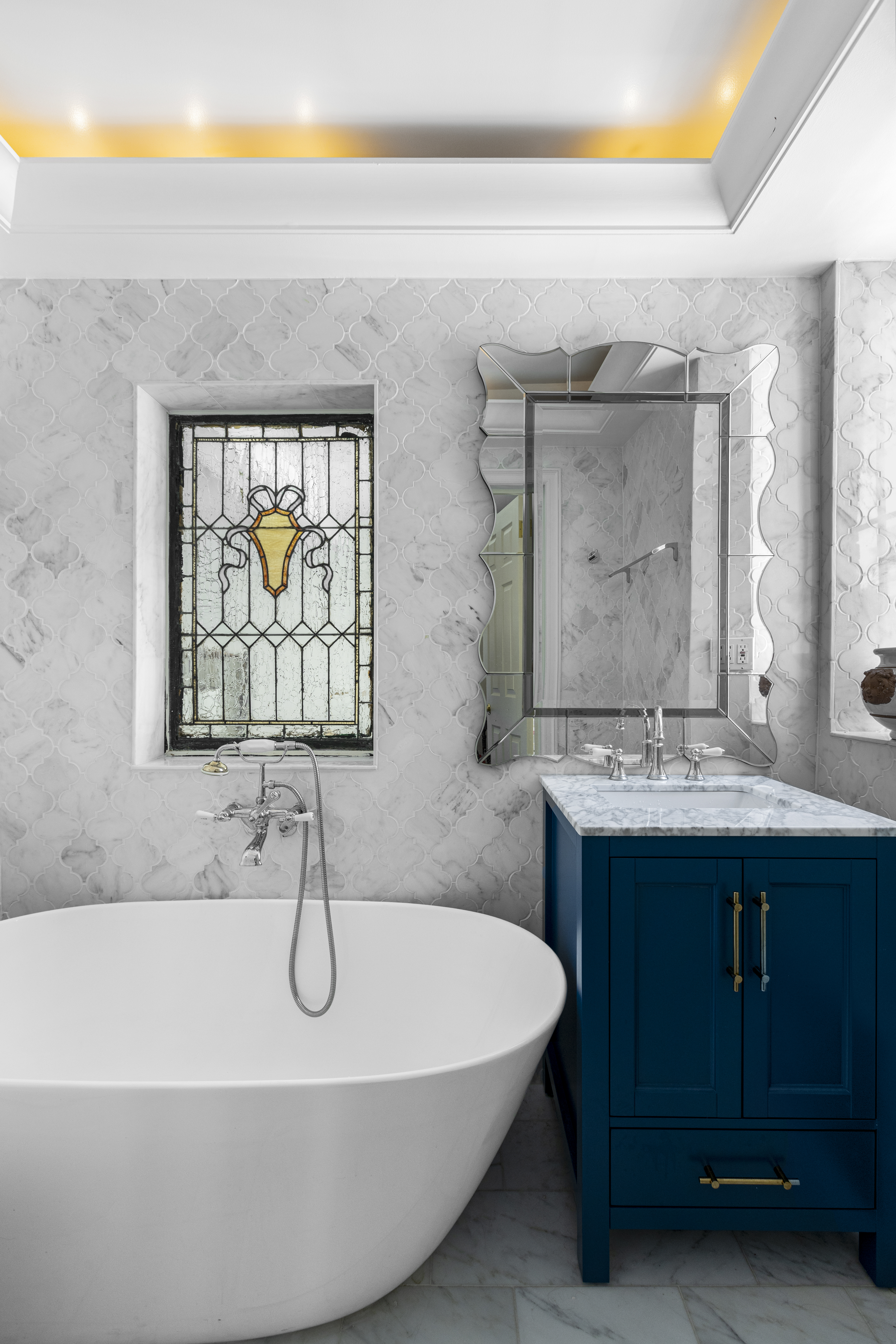 71 East 77th Street, Unit 9C Manhattan, NY 10075 - Photo 9 of 14 a bathroom with a sink and a mirror