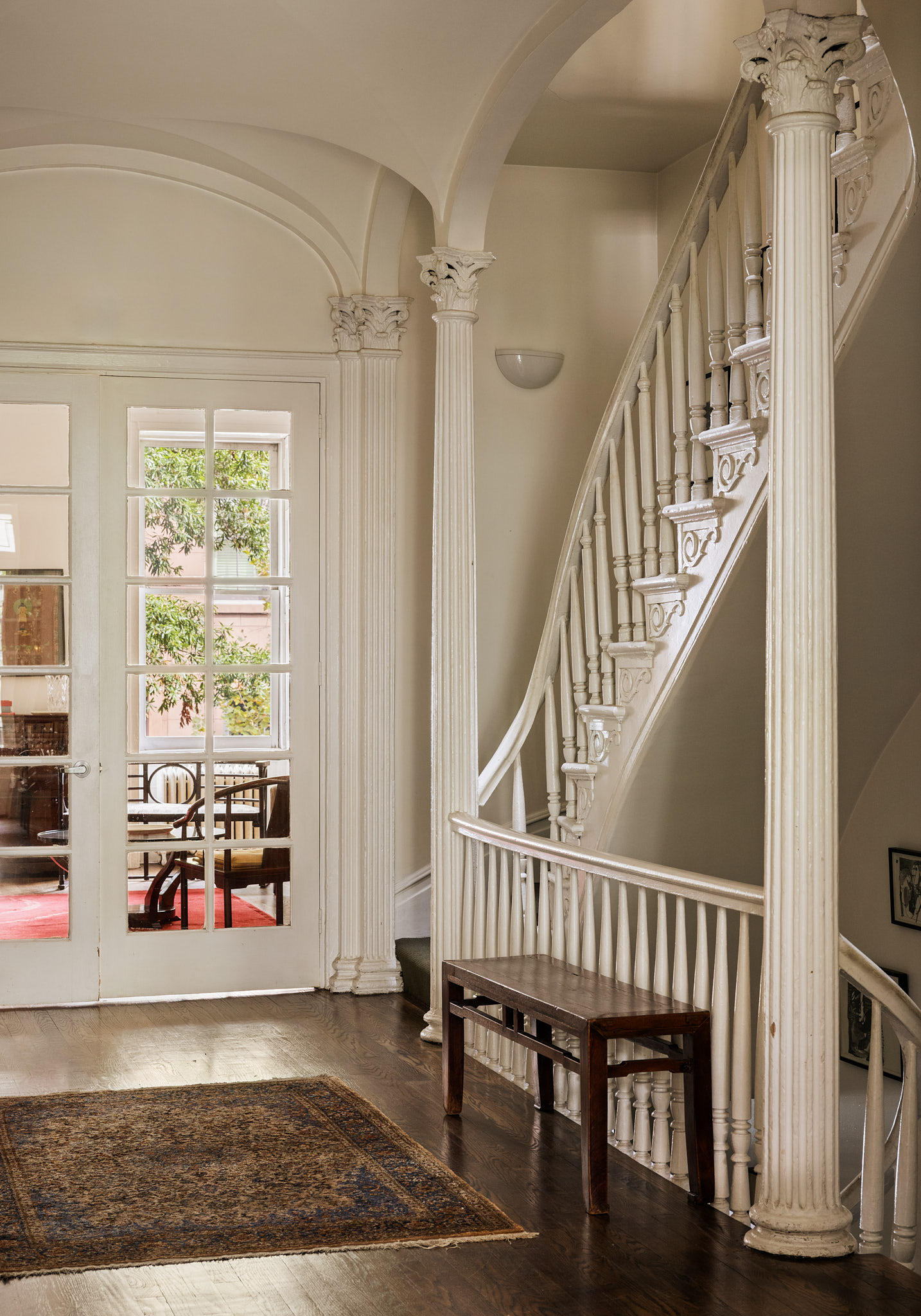 348 West 20th Street Manhattan, NY 10011 - Photo 3 of 18 a view of entryway with wooden floor and stairs