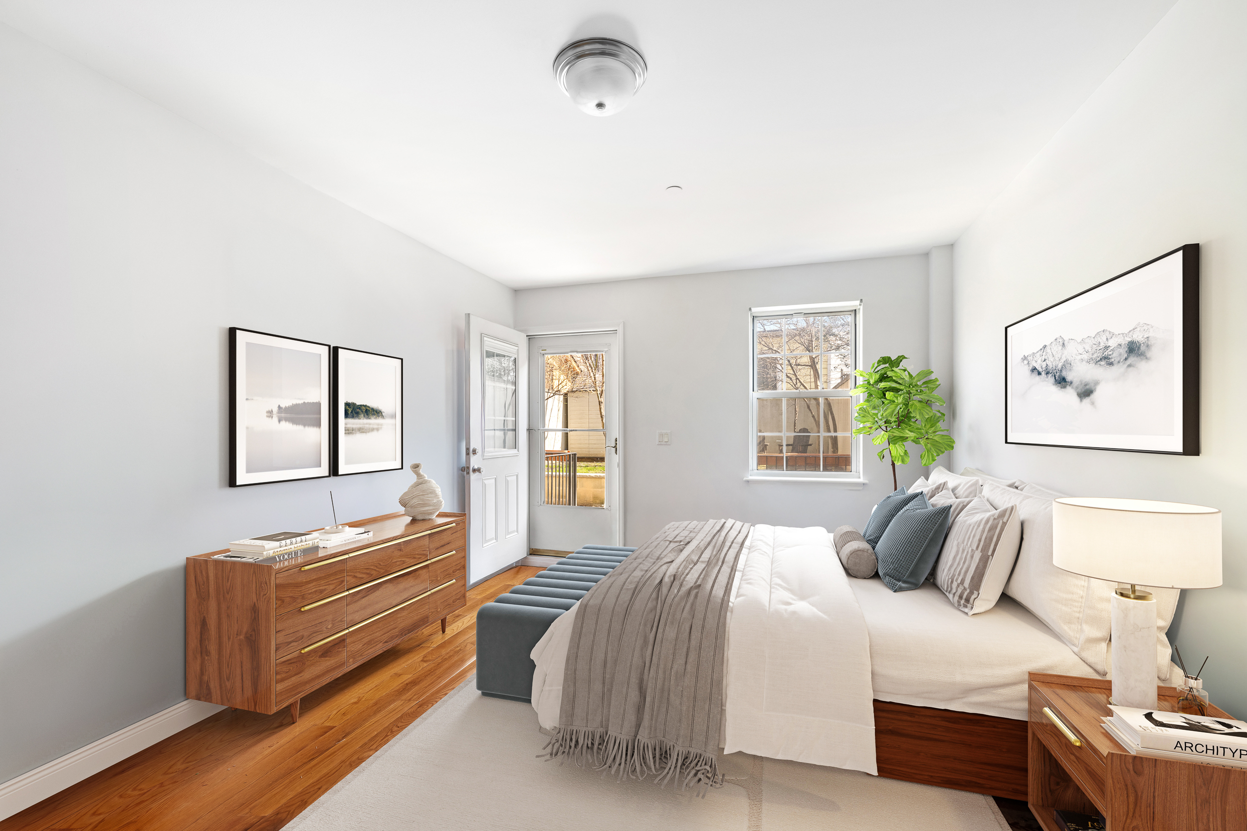 26 Monitor Street, Unit 1 Brooklyn, NY 11222 - Photo 4 of 11 a bedroom with a bed and wooden floor