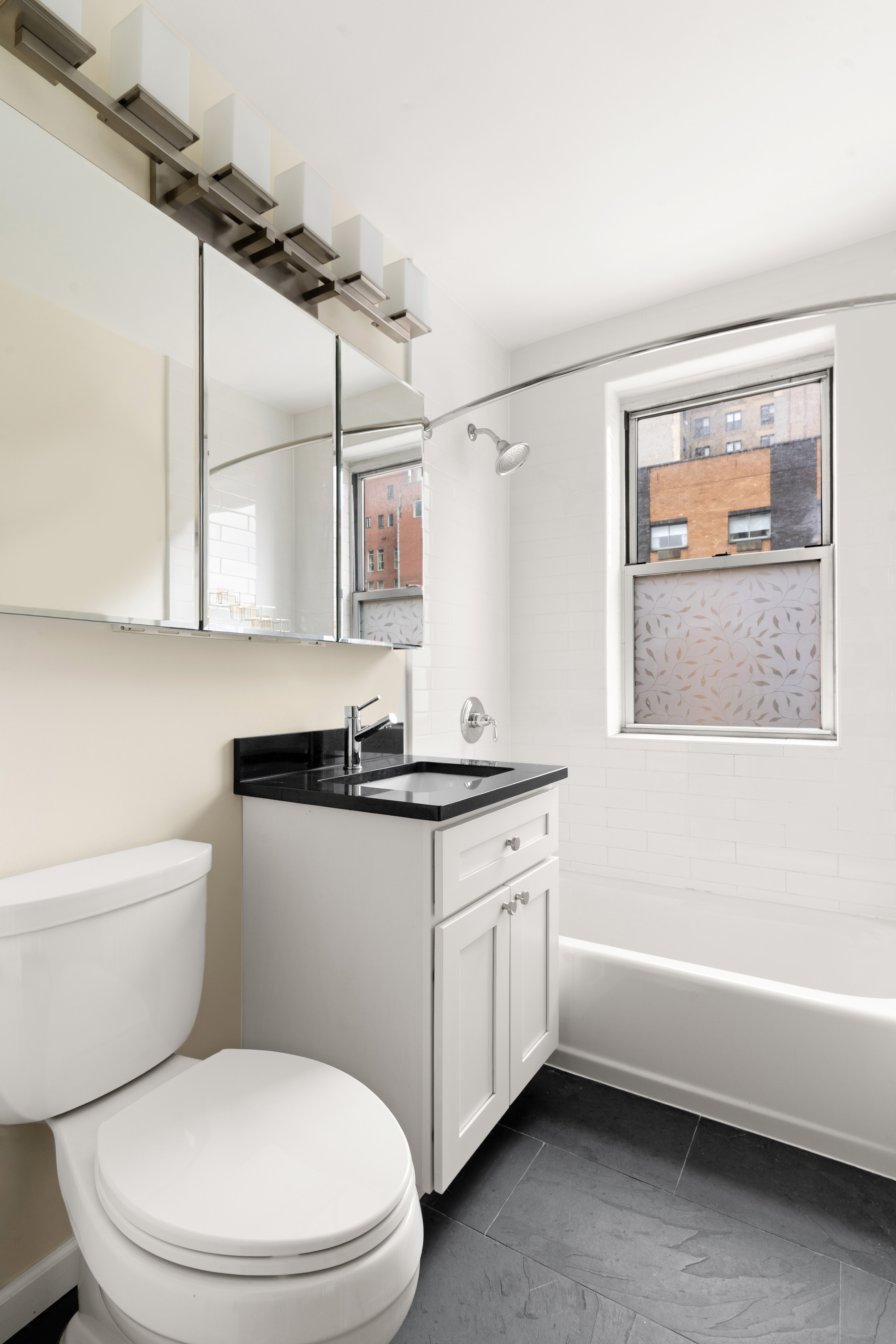 170 West 23rd Street, Unit 5N Manhattan, NY 10011 - Photo 8 of 17 a bathroom with a sink a toilet and bathtub