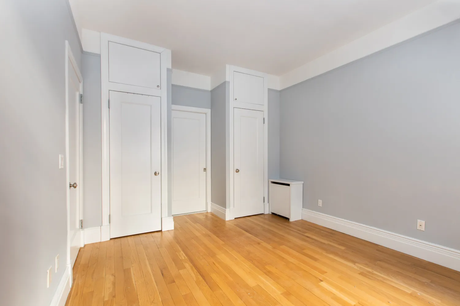 a bedroom with a bed and a toilet