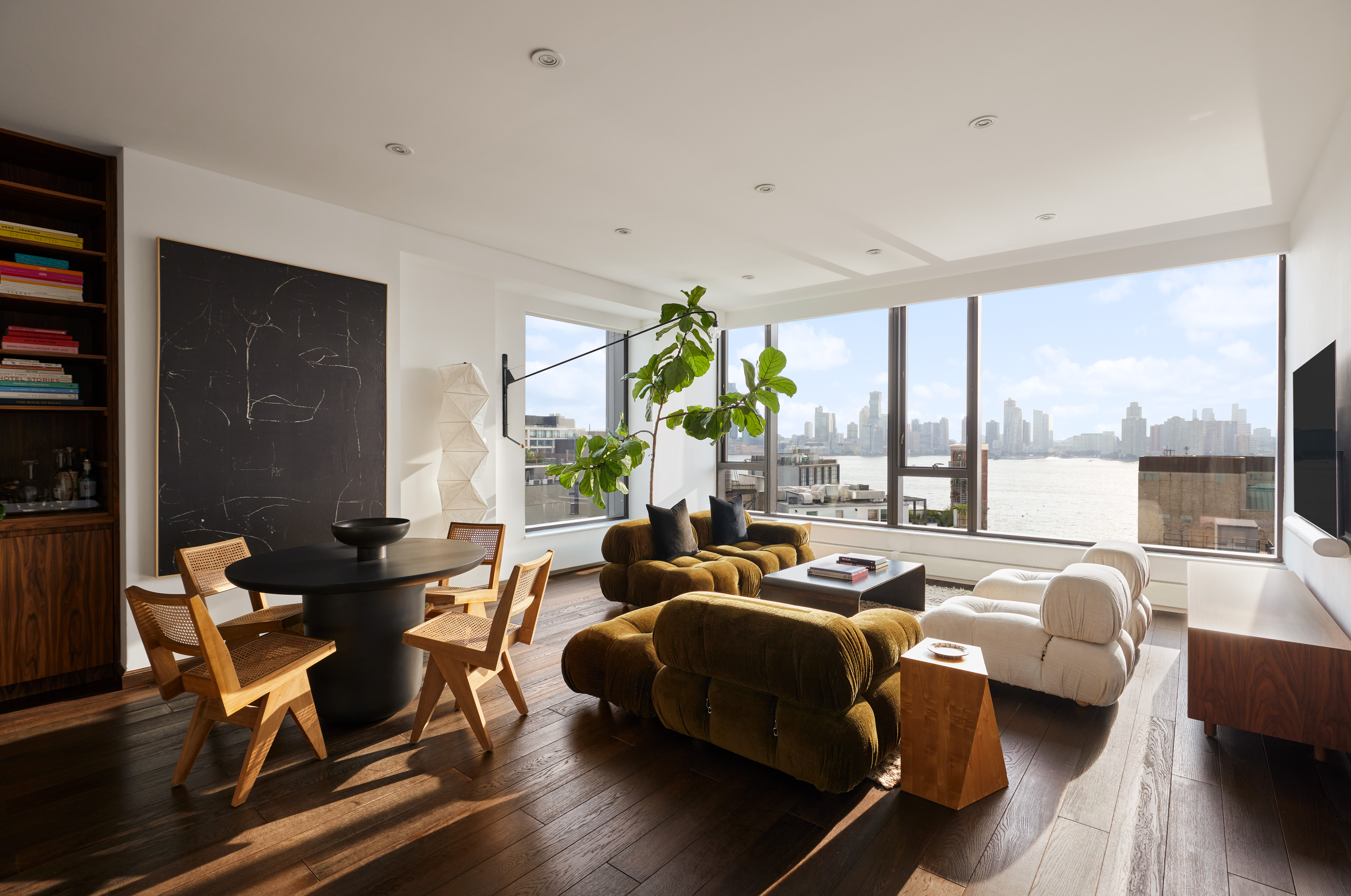 505 Greenwich Street, Unit 14A Manhattan, NY 10013 - Photo 1 of 20 a living room with furniture and a large window