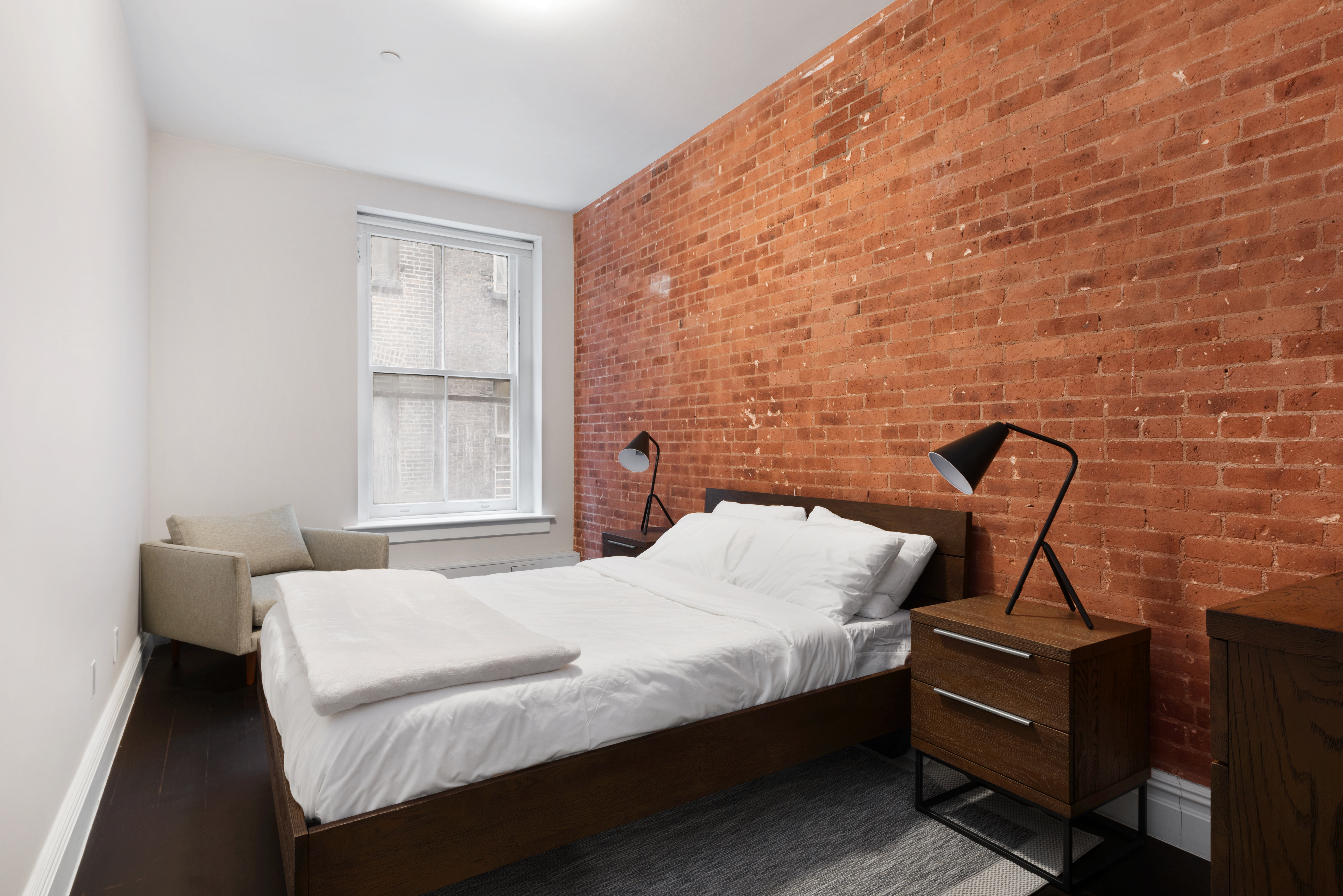 175 Franklin Street, Unit 3 Manhattan, NY 10013 - Photo 5 of 11 a bedroom with a bed and wooden floor