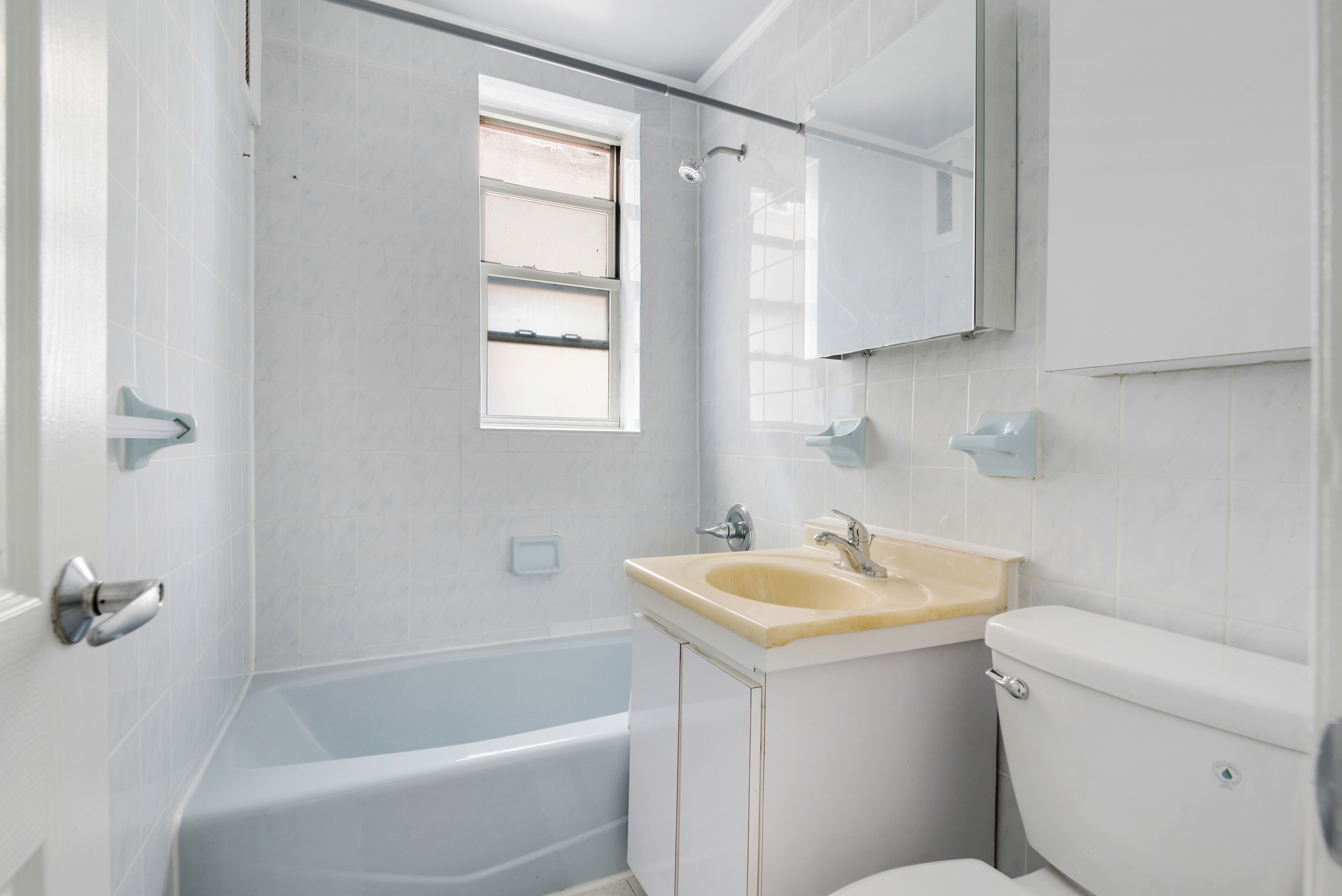 91-11 32nd Avenue, Unit 2 Queens, NY 11369 - Photo 3 of 9 a bathroom with a sink toilet and shower