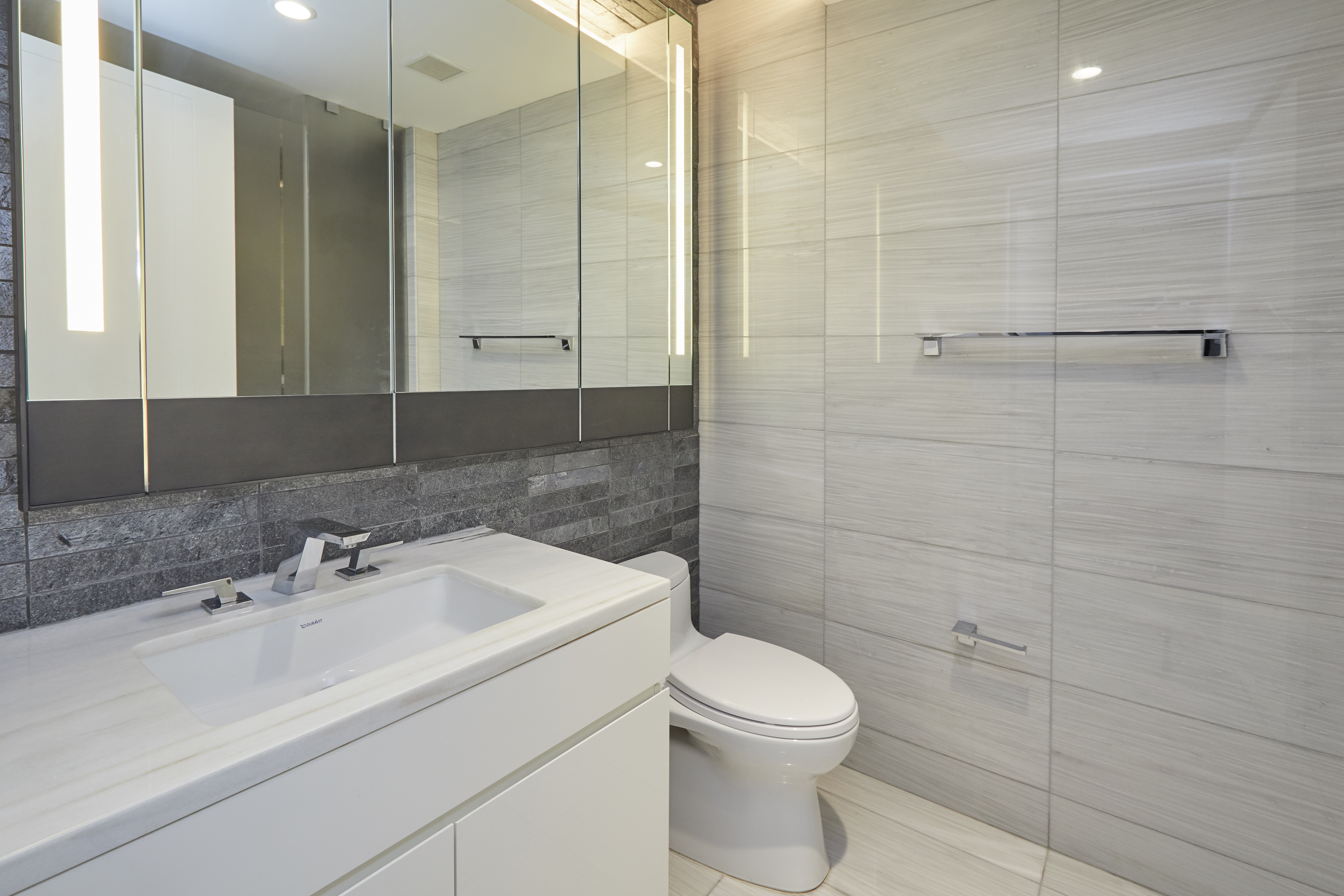 70 Charlton Street, Unit 7E Manhattan, NY 10014 - Photo 9 of 17 a bathroom with a toilet sink and shower