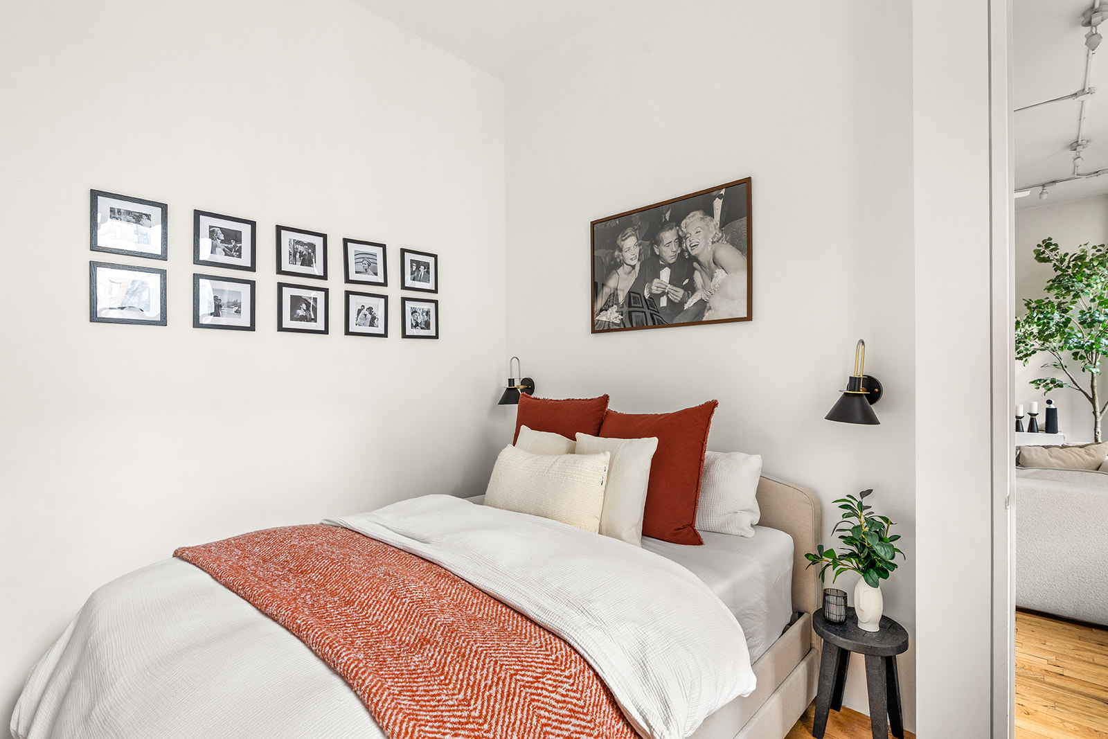 105 5th Avenue, Unit E5 Manhattan, NY 10003 - Photo 10 of 12 a bedroom with a bed and a painting on the wall