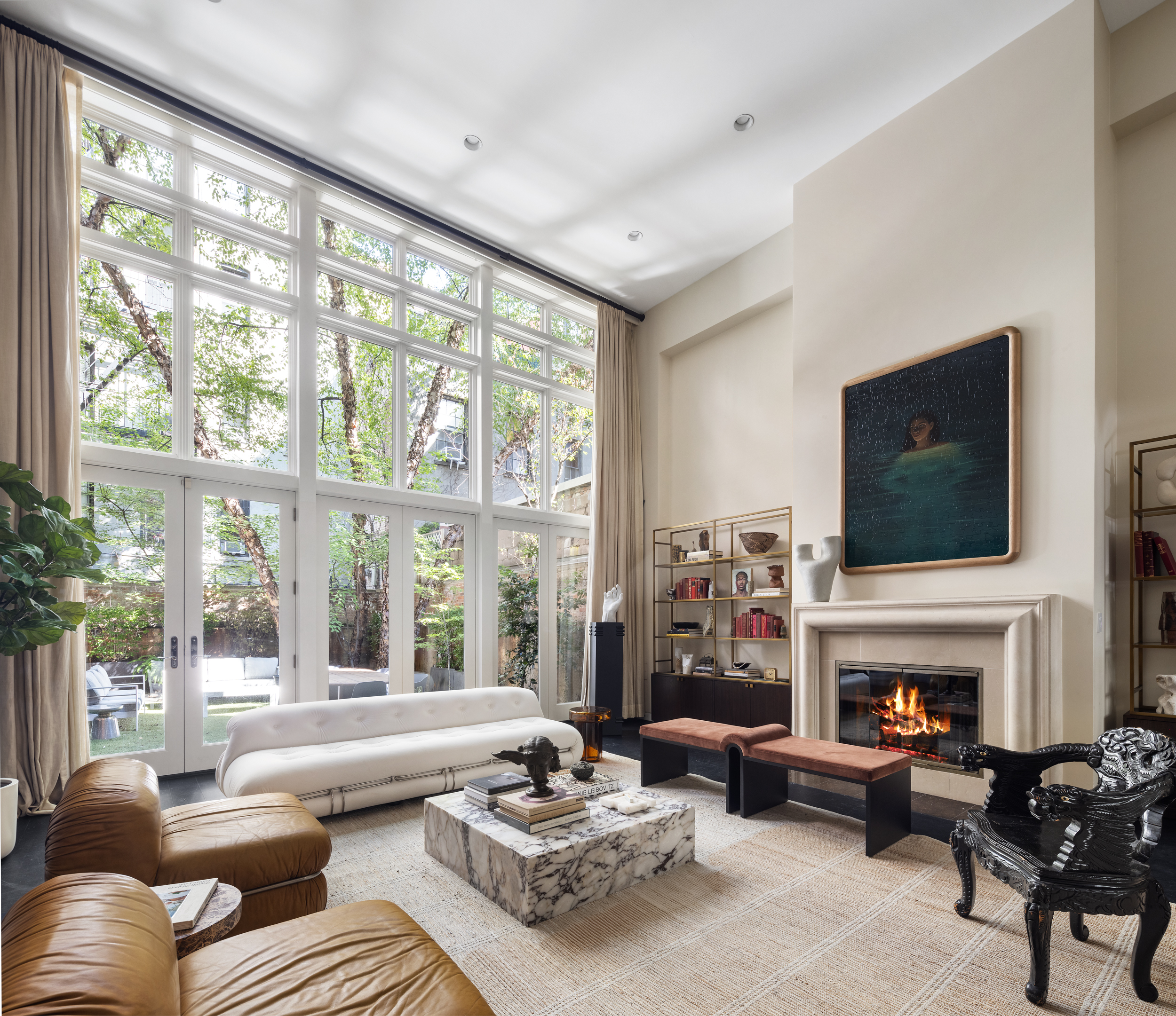 95 Charles Street, Unit TH Manhattan, NY 10014 - Photo 2 of 29 a living room with furniture large window and a fireplace