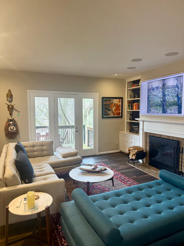 a living room with furniture and a fireplace