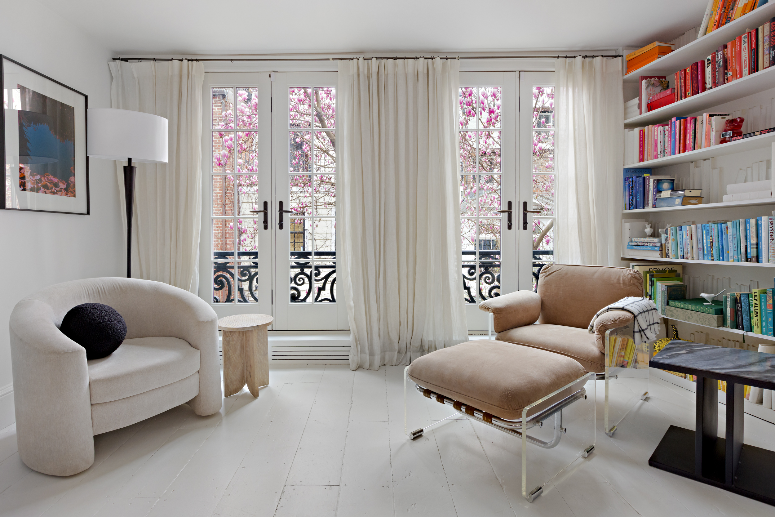 49 Barrow Street Manhattan, NY 10014 - Photo 6 of 25 a living room with furniture and a book shelf