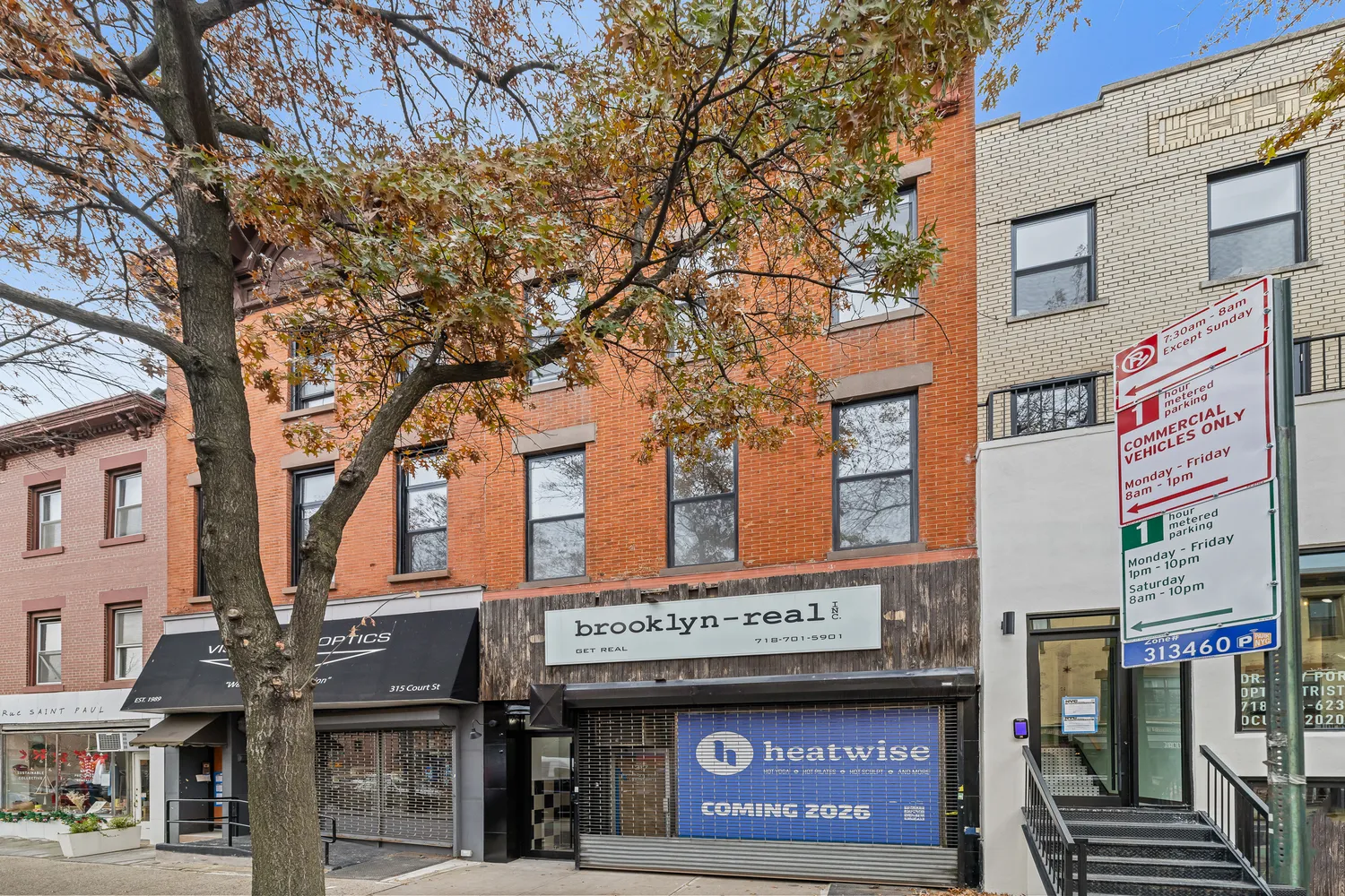 a sign on a pole on a street