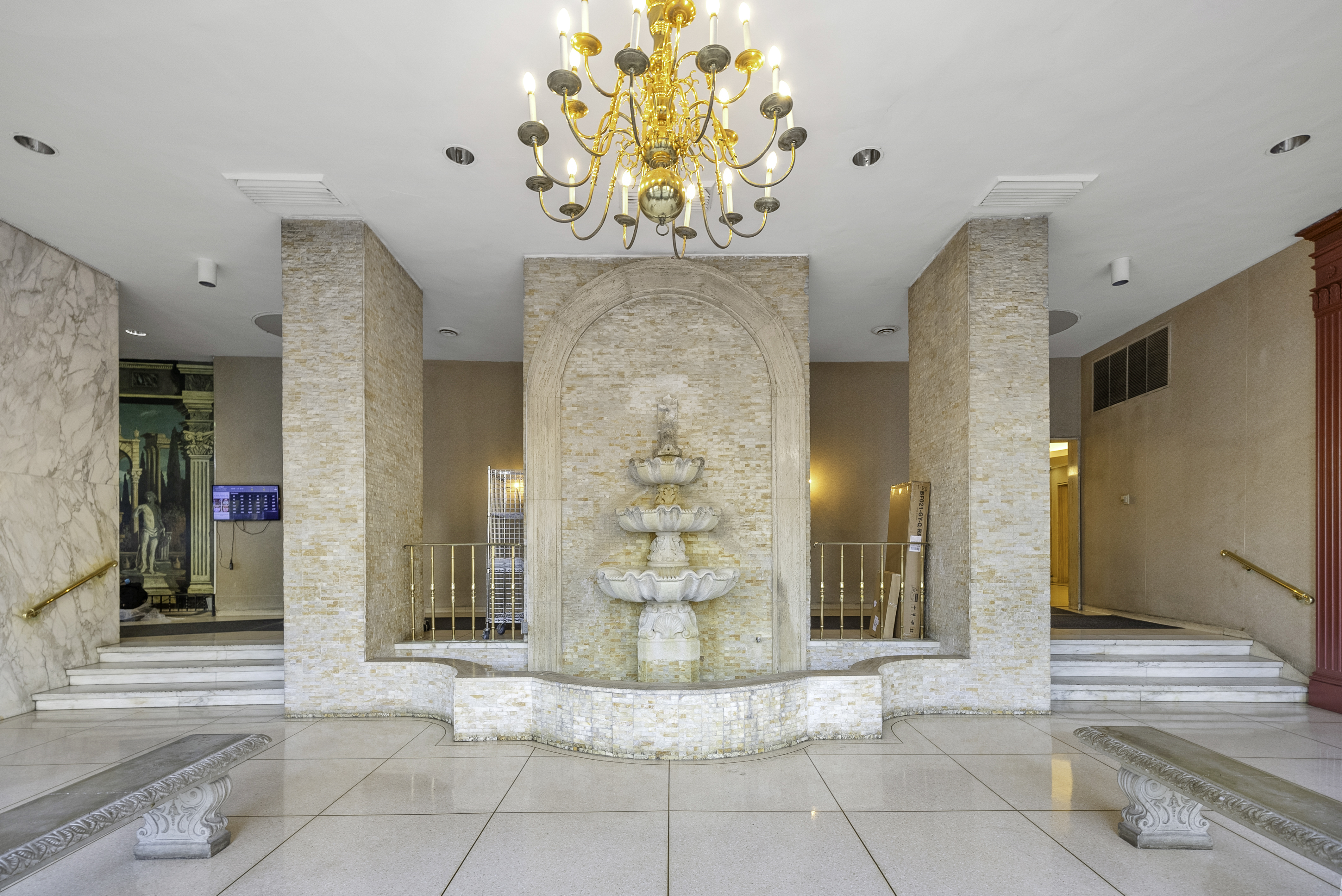 1020 Grand Concourse, Unit 5G Bronx, NY 10451 - Photo 9 of 11 a view of a hallway with a chandelier and living room