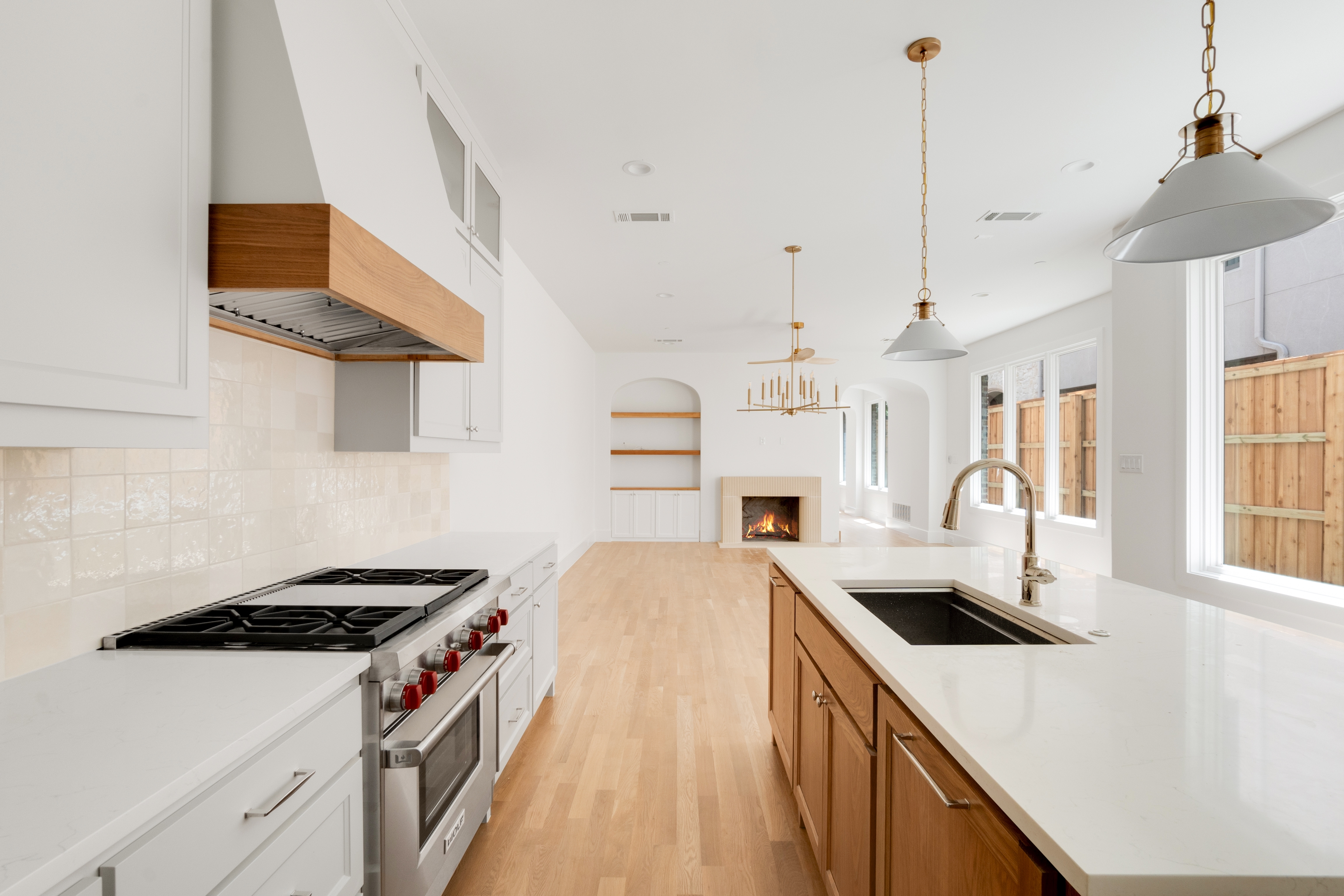 4410 Glenwick Lane Dallas, TX 75205 - Photo 4 of 28 a kitchen with stainless steel appliances granite countertop a sink a stove and a refrigerator