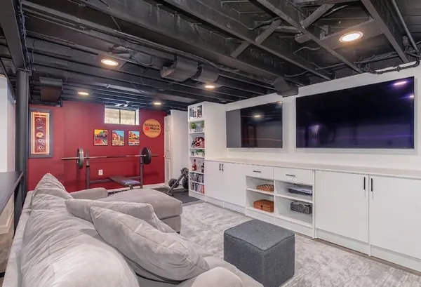 a living room with furniture and a flat screen tv