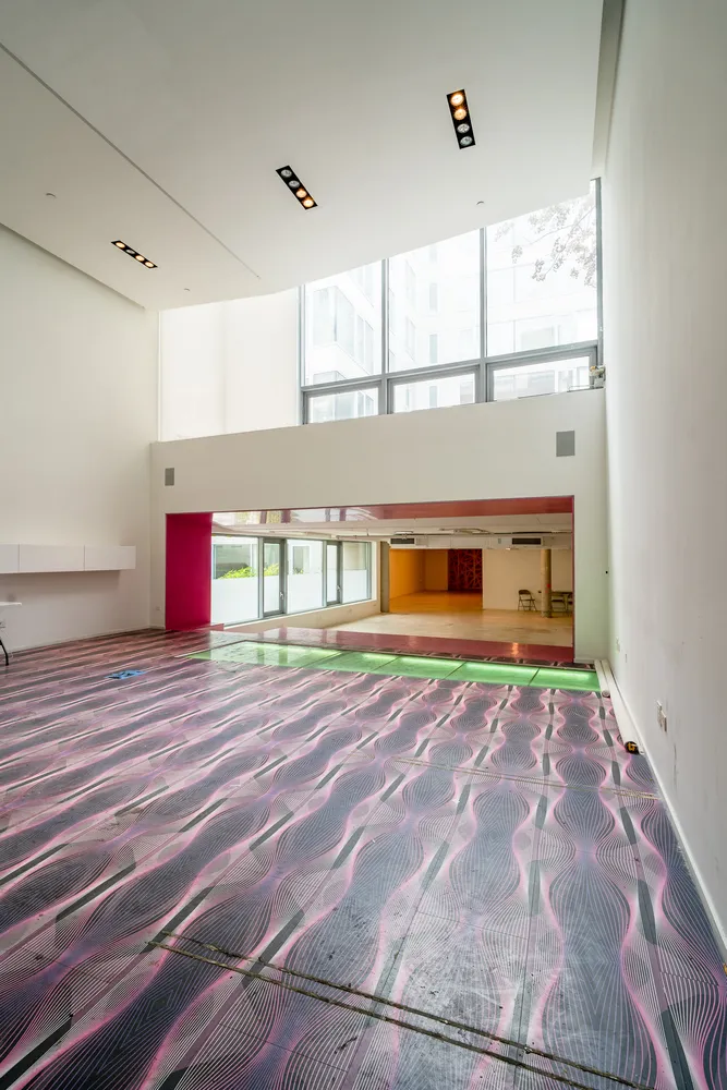 a room with a bed and window