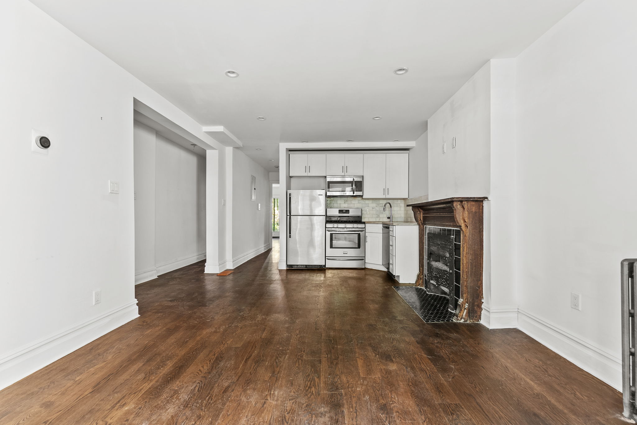 692 10th Street, Unit 1 Brooklyn, NY 11215 - Photo 2 of 12 a view of kitchen with wooden floor and electronic appliances