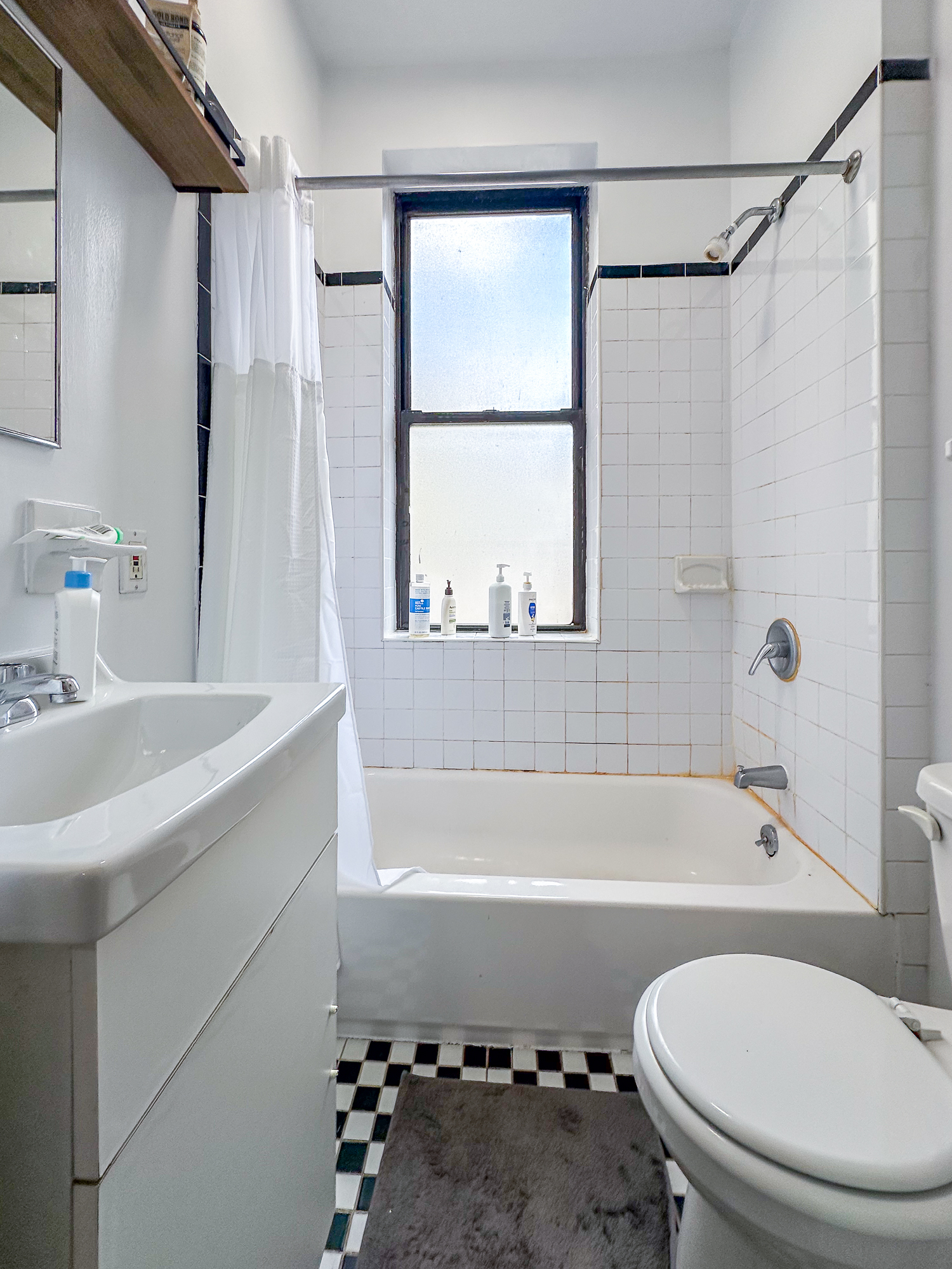 213 East 5th Street, Unit 5 Manhattan, NY 10003 - Photo 12 of 17 a bathroom with a sink a toilet a window and a bathtub