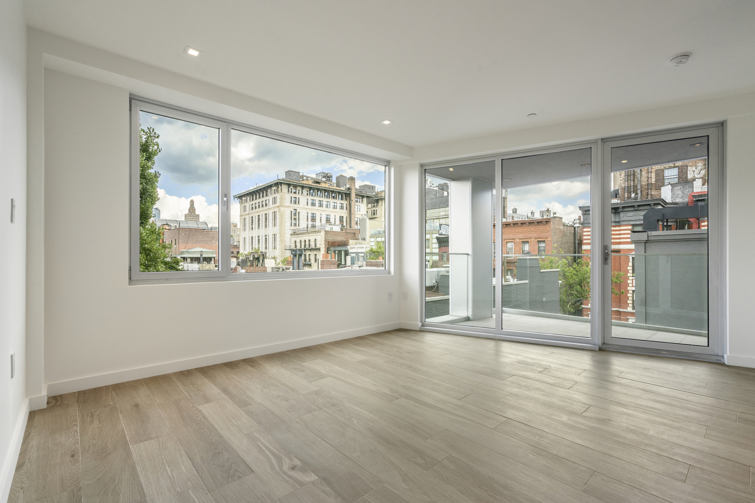 136 West Houston Street, Unit 6 Manhattan, NY 10012 - Photo 9 of 14 a view of an empty room with a window