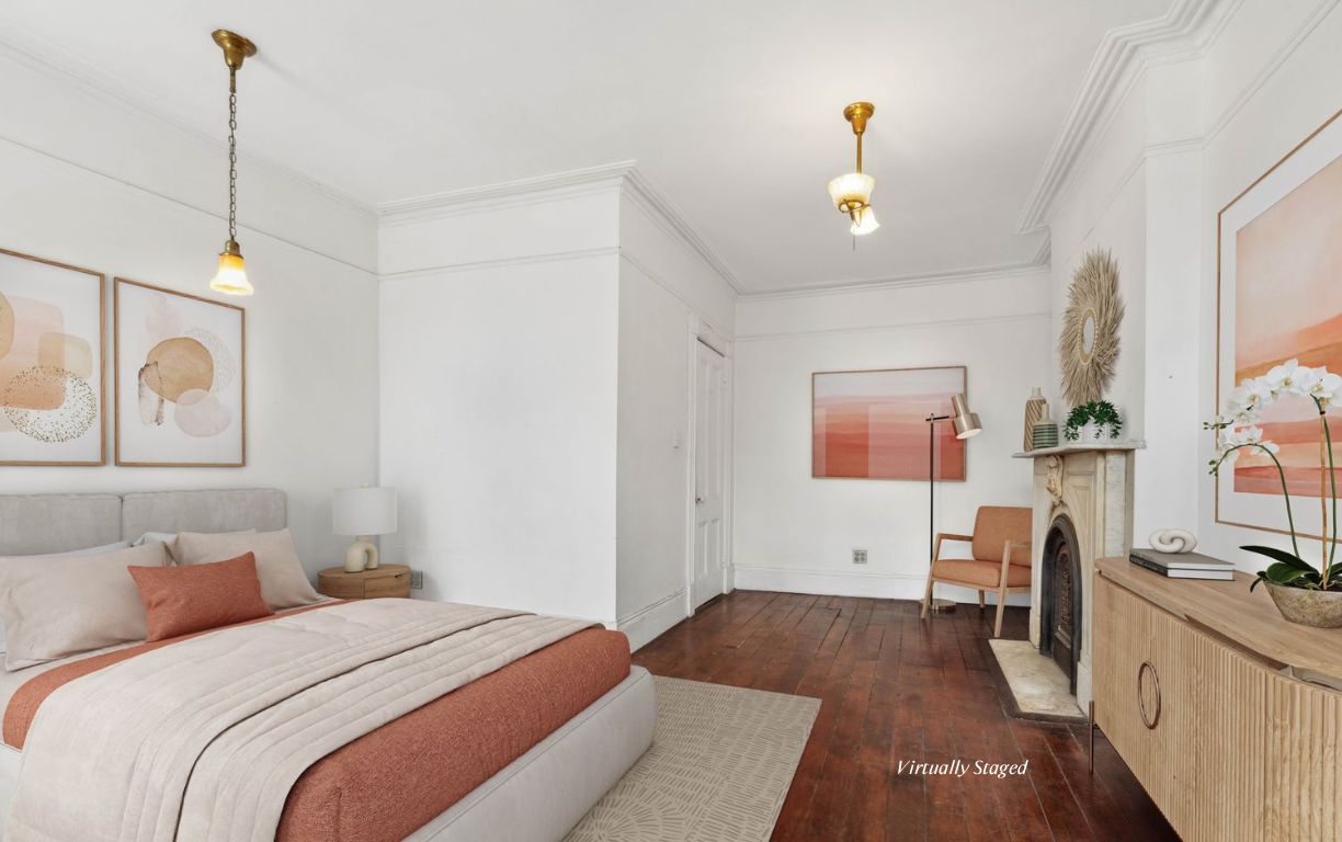 509 6th Avenue Brooklyn, NY 11215 - Photo 12 of 20 a bedroom with a bed and a chandelier