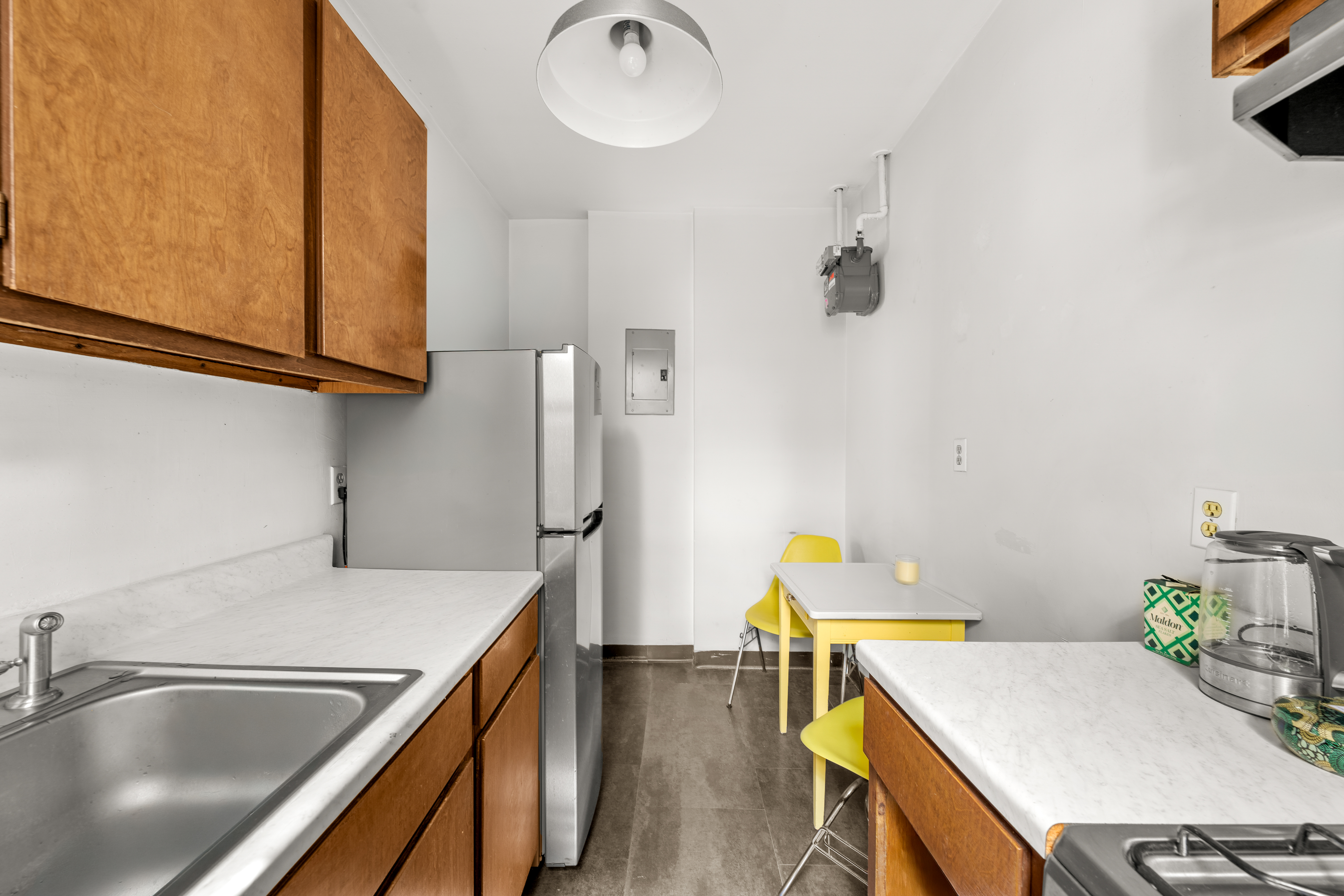 834 Riverside Drive, Unit 3B Manhattan, NY 10032 - Photo 1 of 1 a kitchen with a sink cabinets and stainless steel appliances