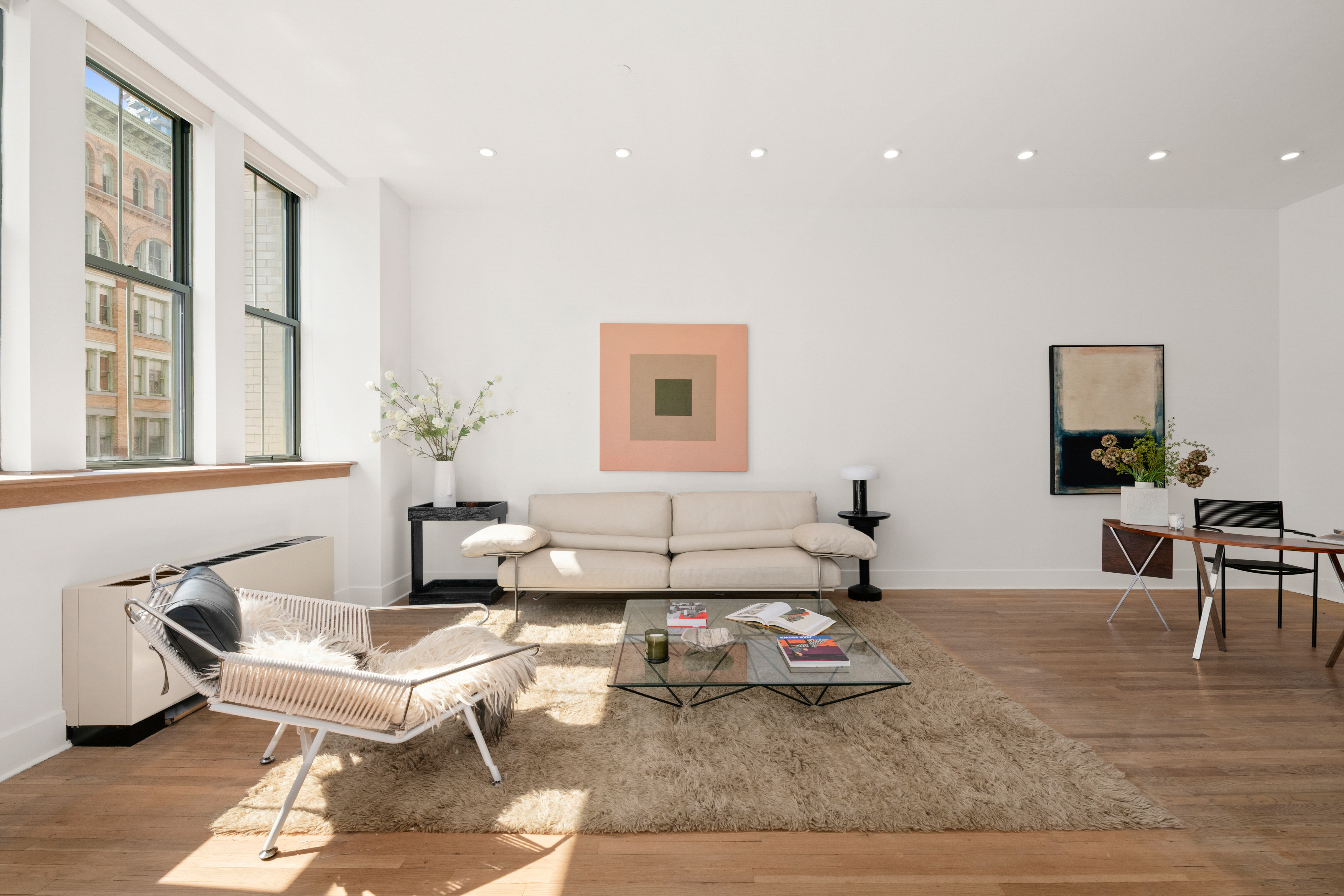 a living room with furniture and next to a window
