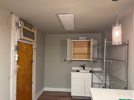 a bathroom with a sink a mirror and a shower