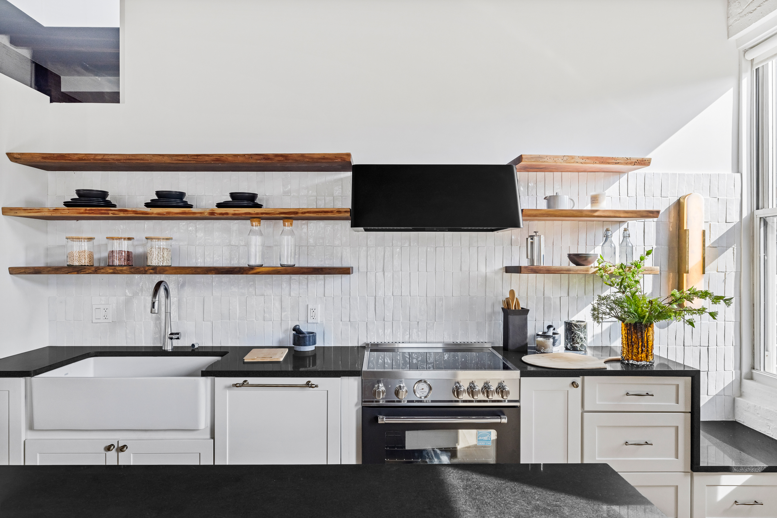 325 Bowery, Unit PH Manhattan, NY 10003 - Photo 8 of 17 a kitchen with stainless steel appliances a sink and a stove