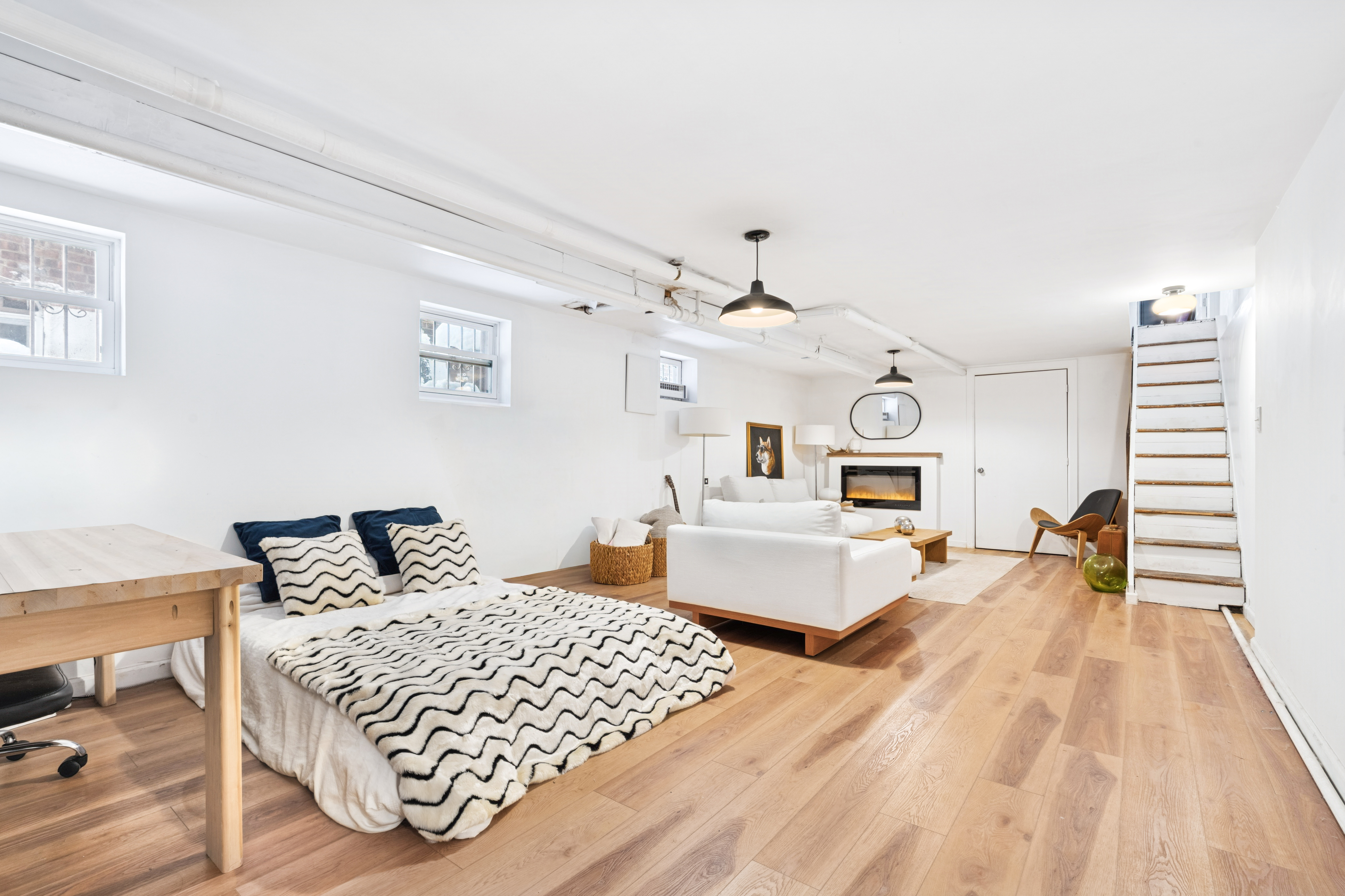 527 East 38th Street Brooklyn, NY 11203 - Photo 11 of 15 a bedroom with a large bed and a chandelier