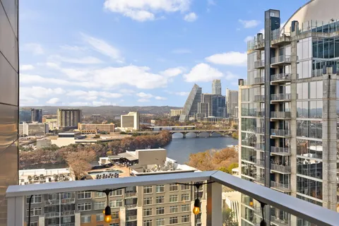 a view of a balcony with city view