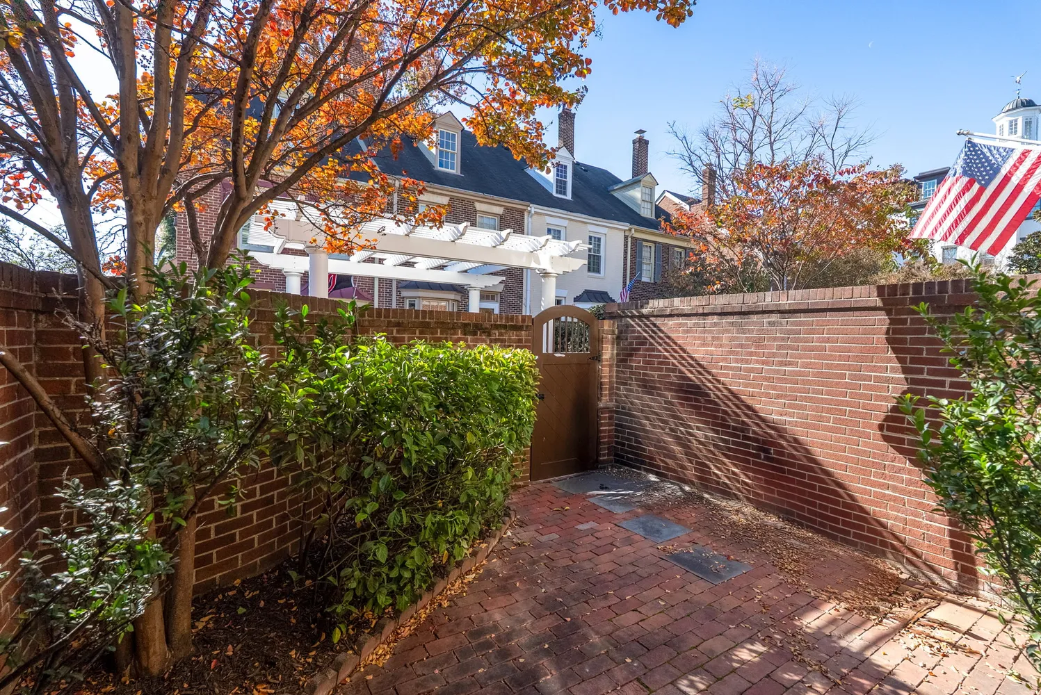 a pathway of a house with a tree