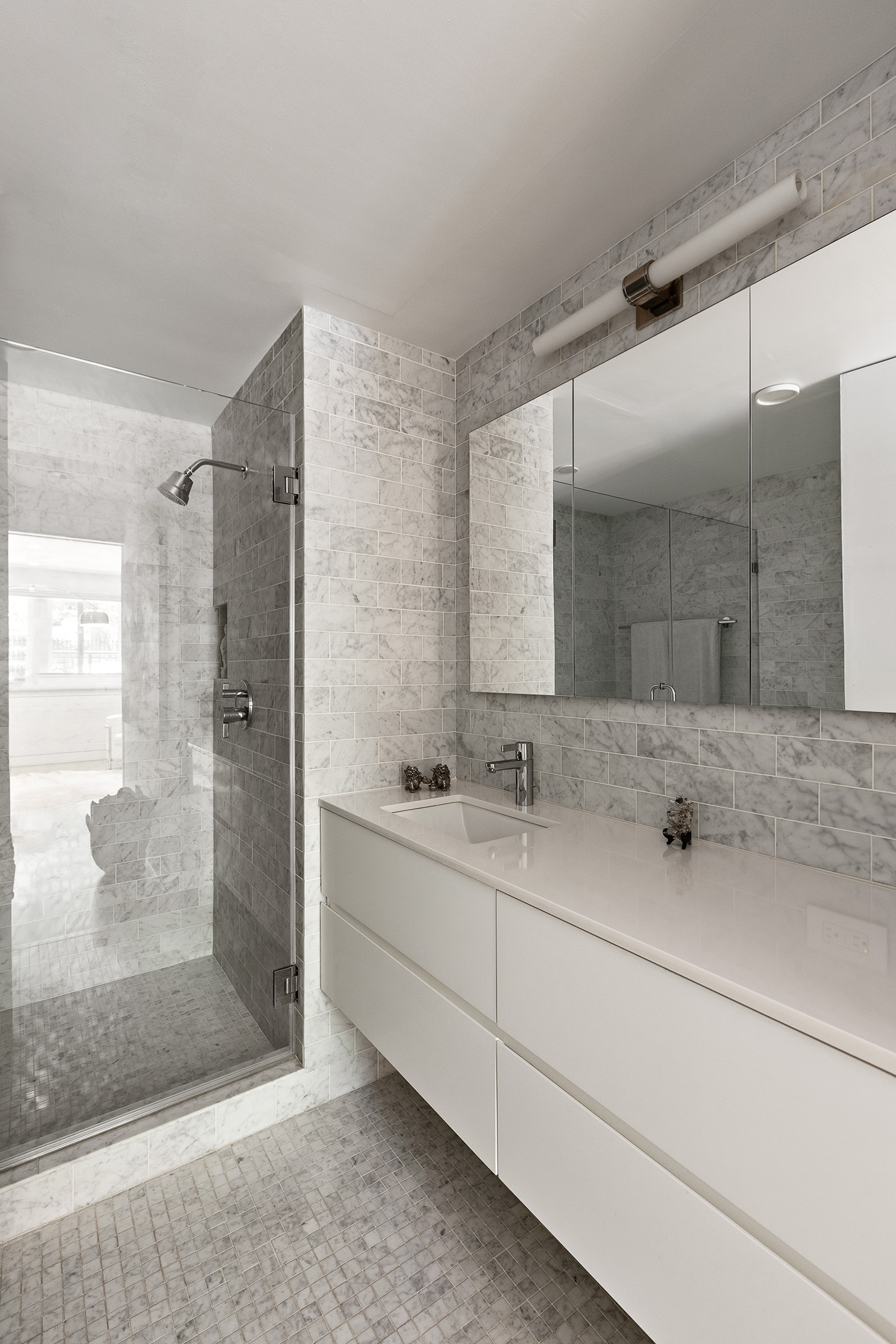 48 Gramercy Park North, Unit 1A Manhattan, NY 10010 - Photo 9 of 14 a bathroom with double sink and a mirror