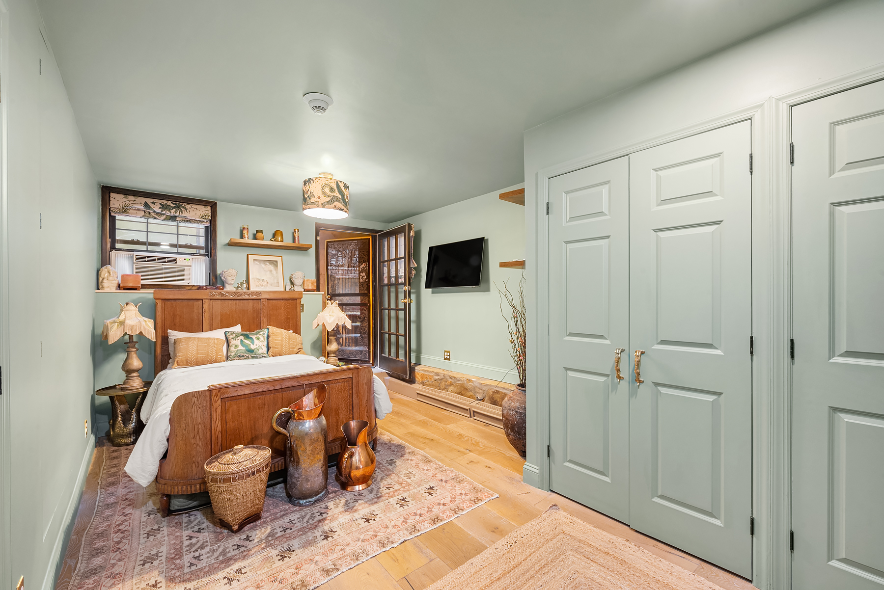 57 Sullivan Street, Unit DUPLEX Manhattan, NY 10012 - Photo 4 of 9 a bedroom with a bed and a window