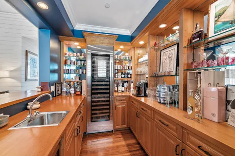 a kitchen with stainless steel appliances a sink and a refrigerator