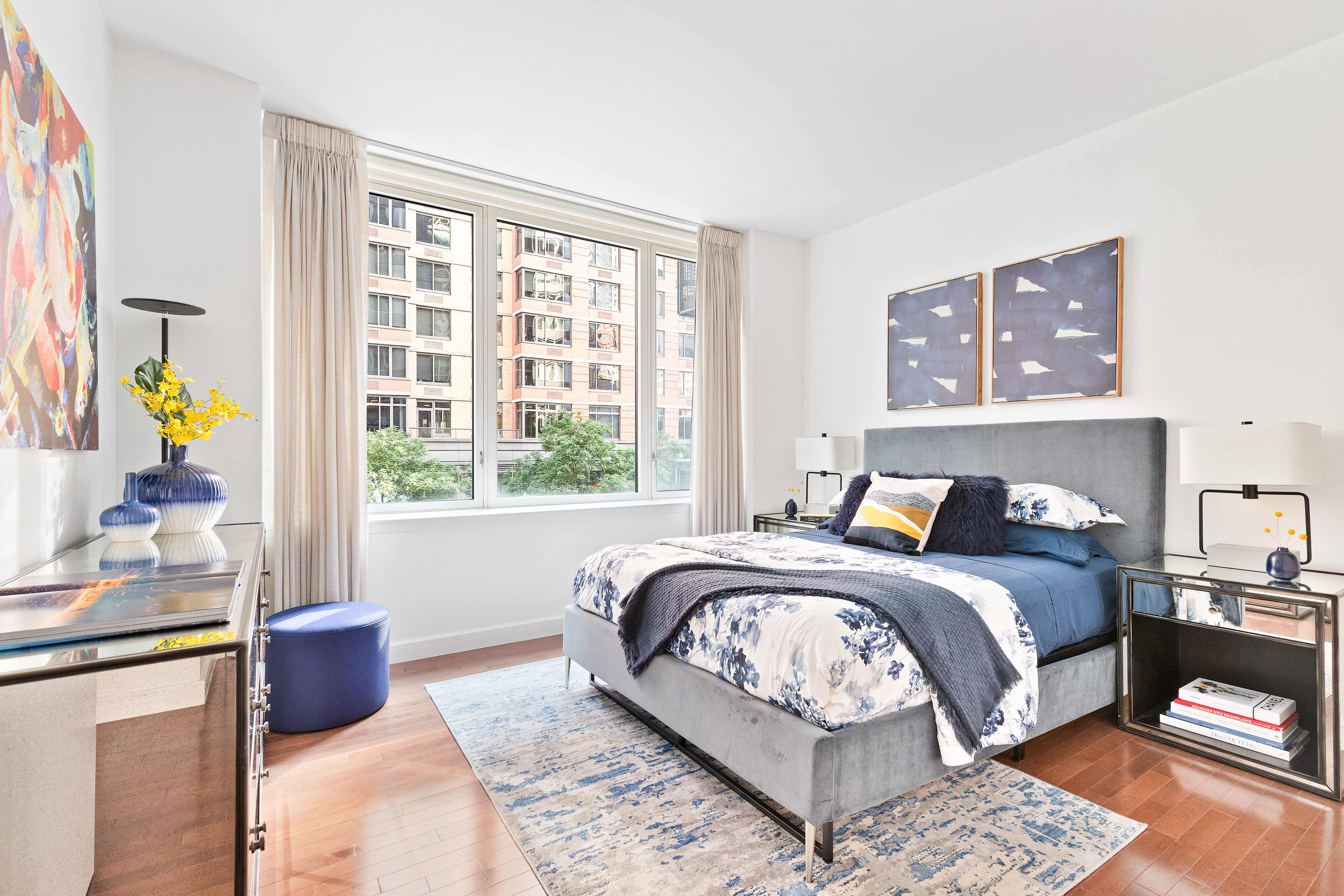 225 East 34th Street, Unit 3H Manhattan, NY 10016 - Photo 3 of 18 a bed sitting in a bedroom next to a window