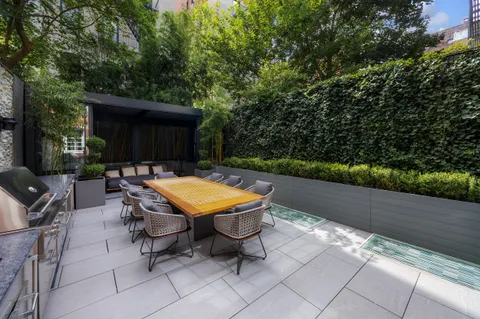 a view of a wooden deck with furniture