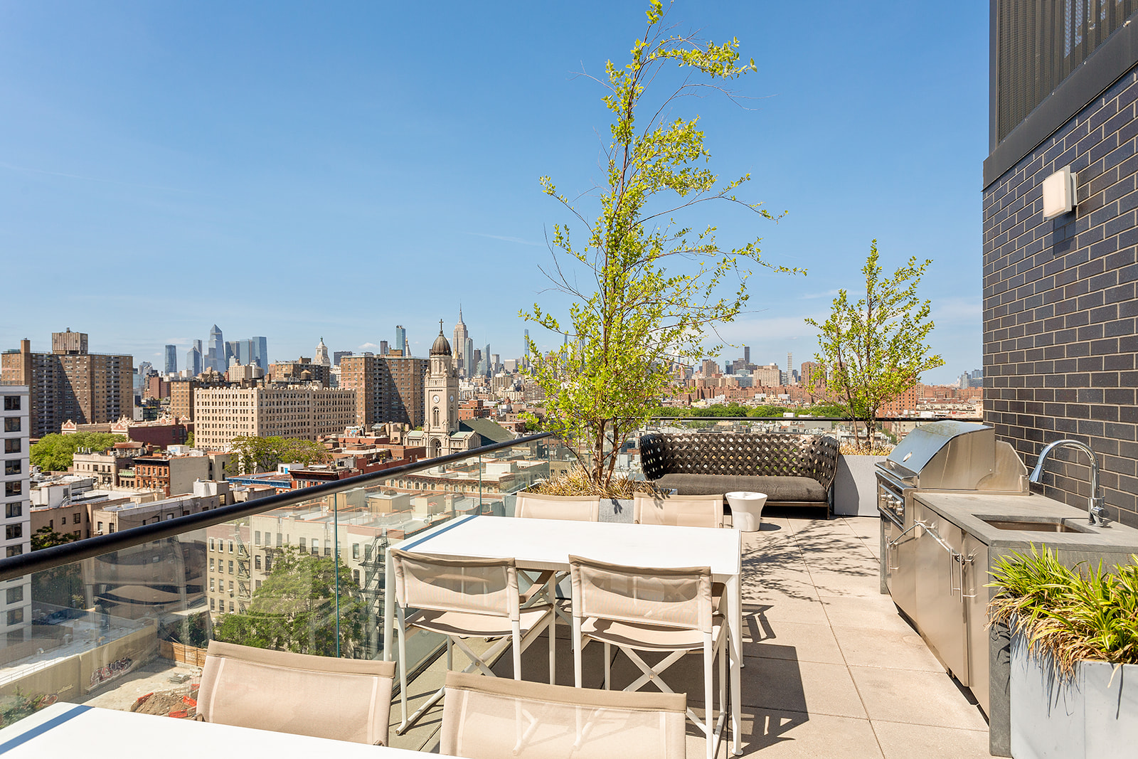 287 East Houston Street, Unit 5B Manhattan, NY 10002 - Photo 5 of 7 a view of a swimming pool with outdoor seating and city view